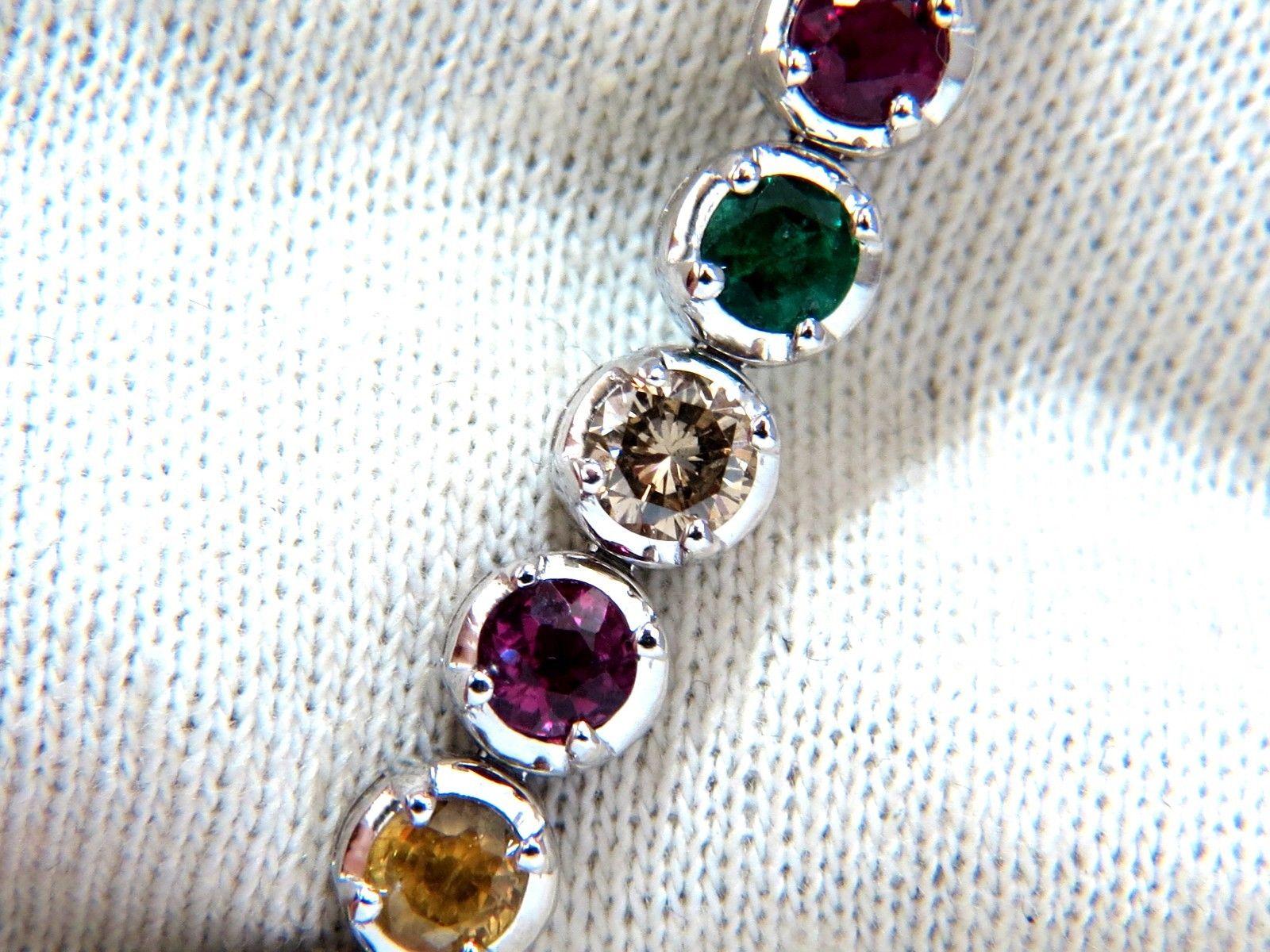 Gem Line.

10.30ct. Natural Sapphires, Ruby, & Emeralds bracelet.

Full round cuts, great sparkle.

Multicolor sapphires.

Vibrant Greens, yellows, Blues & Pinks

Clean Clarity & Transparent.

4 Round Diamonds: 1.30ct

Secure pressure clasp and