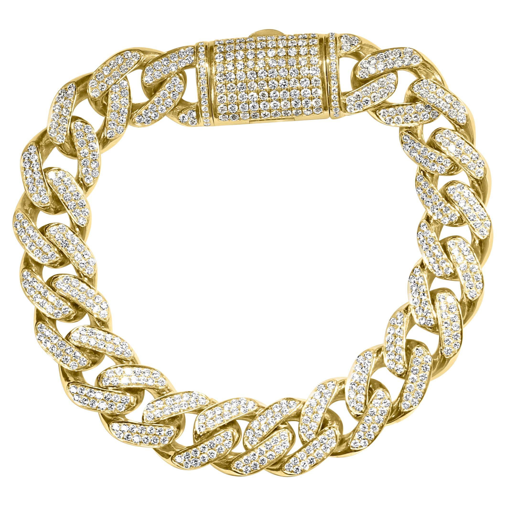 Ce superbe bracelet Miami à maillons cubains en diamant, fabriqué à la main en or jaune 14 carats massif, pèse un poids impressionnant de 89,3 grammes. Il met en valeur 642 diamants blancs de taille ronde, totalisant 10,32 carats, magistralement