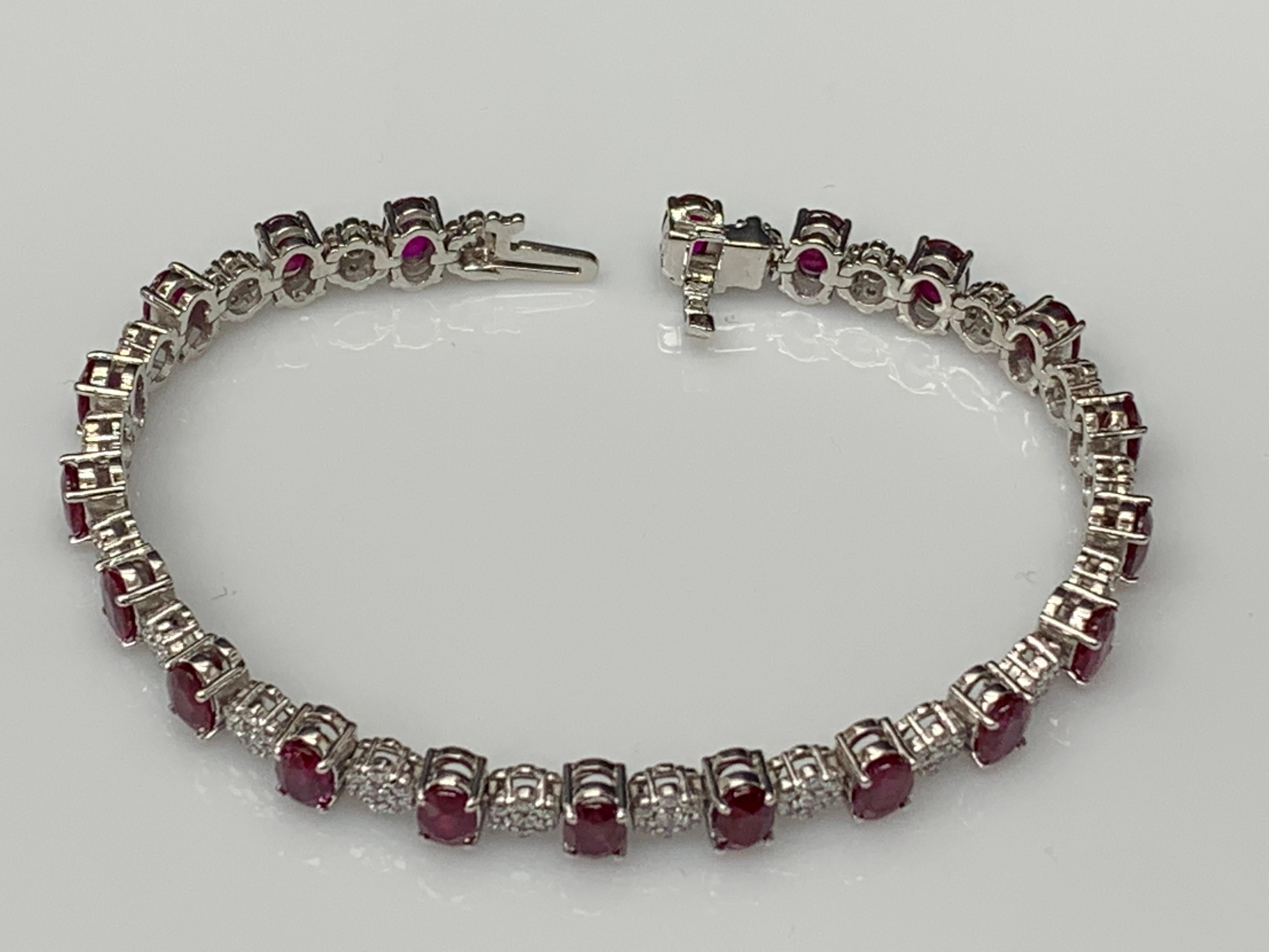 A fashionable and color-rich tennis bracelet showcasing oval cut 20 Ruby weighing 10.34 carats total, spaced by 140 flower shape round brilliant diamonds weighing 1.18 carats total. Made in 14k white gold.

All diamonds are GH color SI1 Clarity.
Can