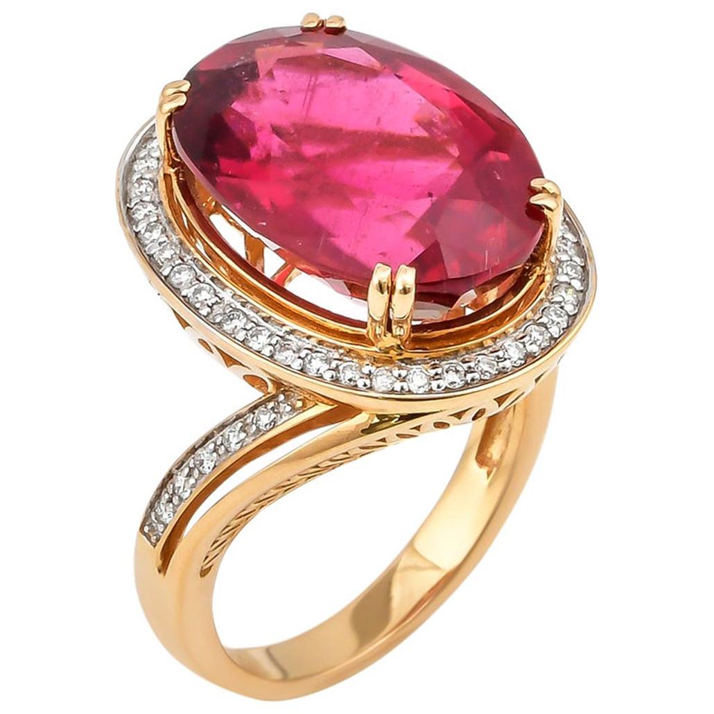 10.34 Carat Oval Shaped Rubelite Ring in 18 Karat Yellow Gold with Diamonds For Sale