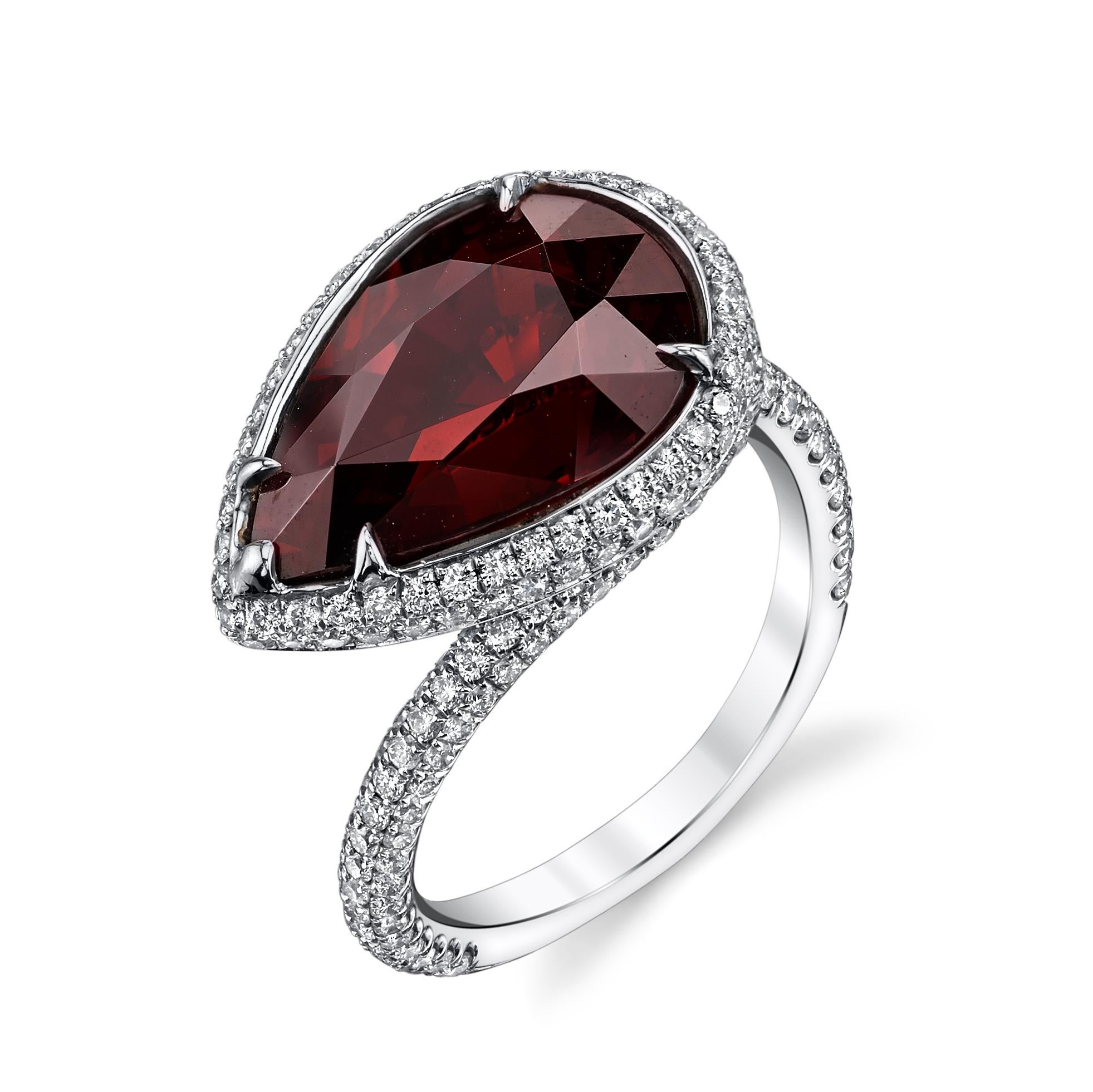 Sensual and sleek, this ring features a stunning pear-shaped Garnet that instantly captures your attention. The Ancient Egyptians frequently adorned themselves with crowns dazzled with garnet. It was considered to be the single most prized