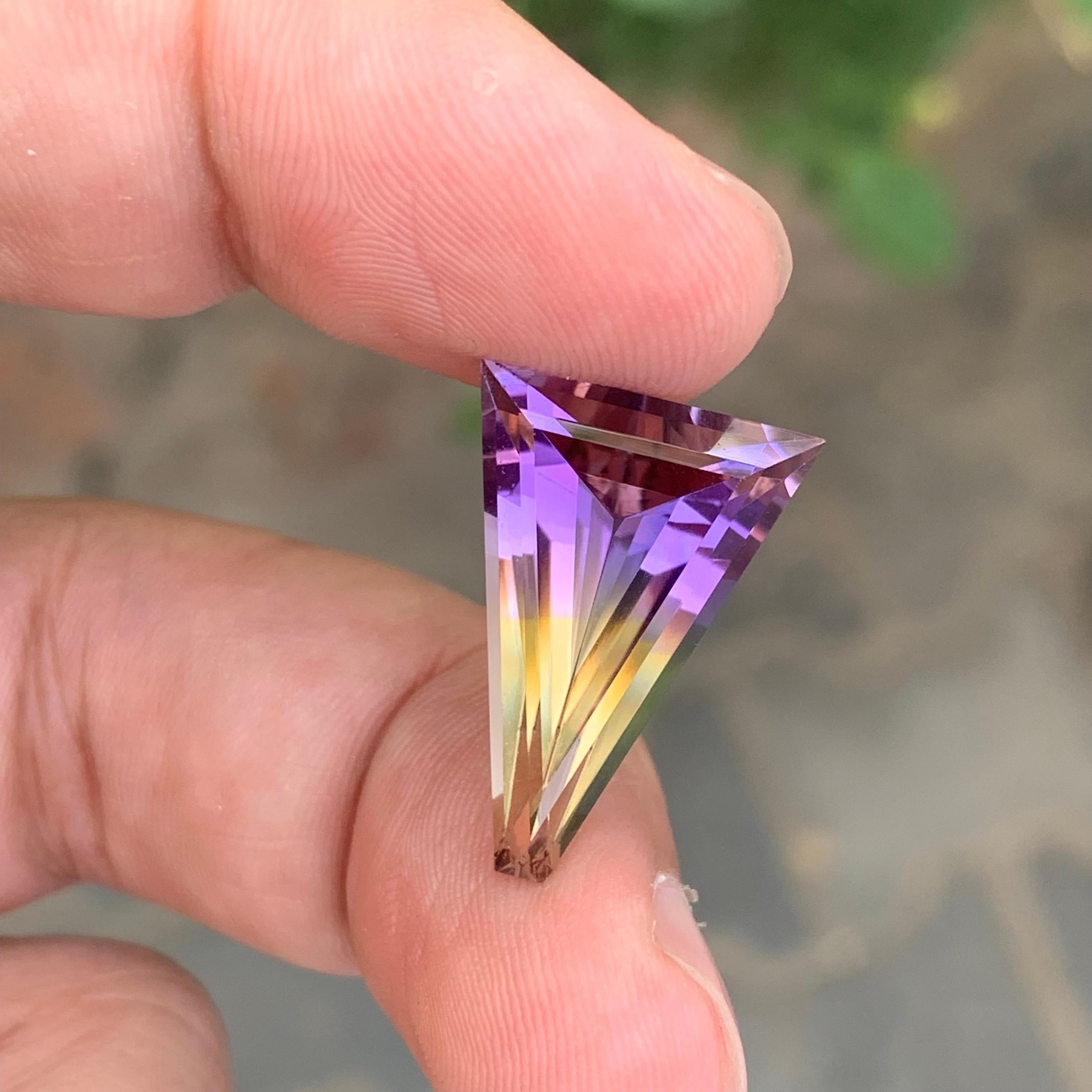 Faceted Ametrine

Weight: 10.35 Carats
Dimension: 21 x 14.5 x 8.2 Mm
Shape: Trilliant 
Color: Purple & Yellow
Treatment: Non
Certificate: On Client Demand
.
Ametrine is a unique and striking gemstone that combines both amethyst and citrine in a