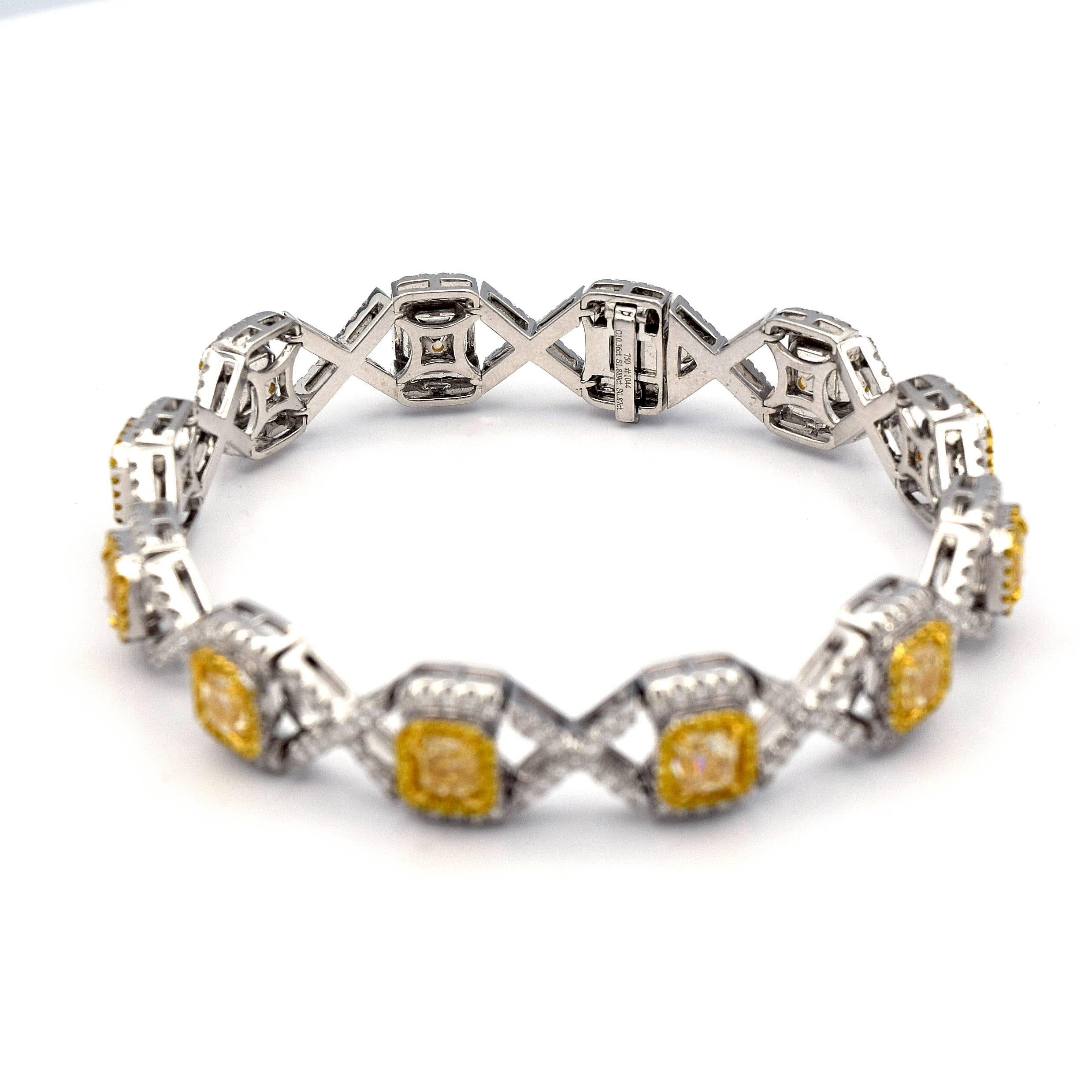 Gorgeous White and Yellow Diamond bracelet, that contains 12 Radiant Cut Fancy Yellow Diamonds, giving it a total weight of 10.36ct. 

It is mounted in 18K White Gold, giving it a total weight of 33.72 grams.