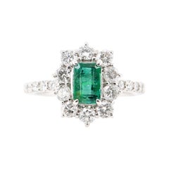 1.037 Carat Colombian Emerald and Diamond Cluster Ring Set in Platinum 1.037 Carat Colombian Emerald and Diamond Cluster Ring Set in Platinum