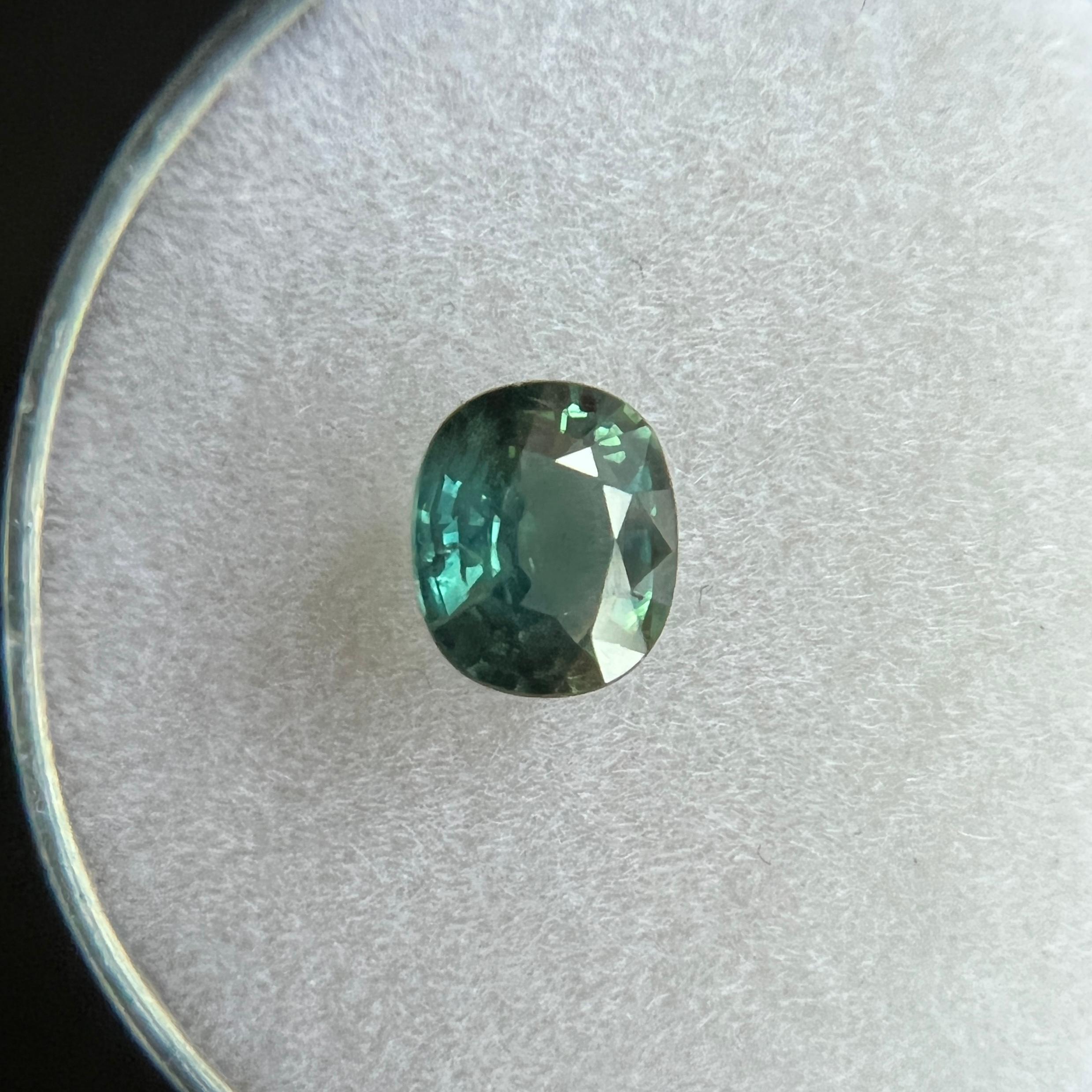Vivid Blue Green Australian Sapphire Gemstone.

Natural sapphire with a stunning deep greenish blue colour. 1.03 Carat with good clarity. Clean stone with only some very small natural inclusions visible when looking closely.

Also has a very good