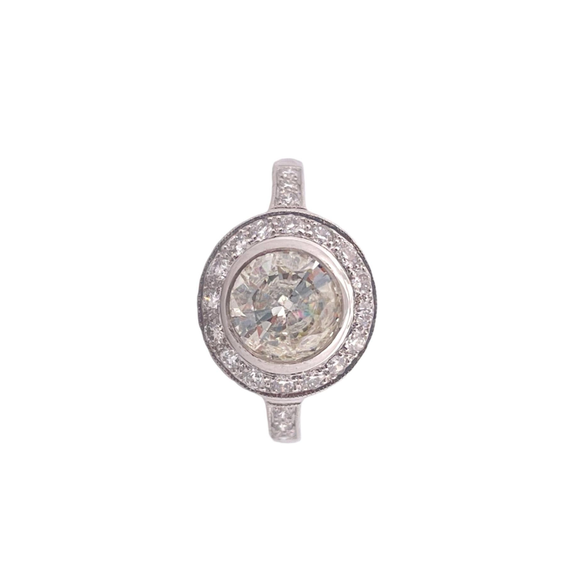 Indulge in the ultimate expression of luxury with this exquisite Diamond Halo Ring, featuring a brilliant 1.03-carat center diamond,
surrounded by a mesmerizing halo of diamonds with a total carat weight (TCW) of 0.40. 
This stunning piece is set in