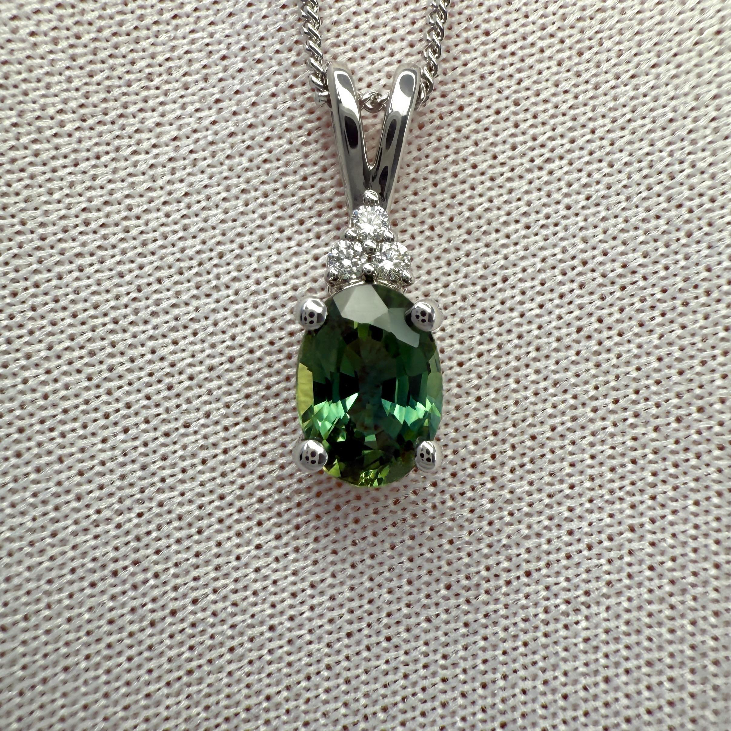 Natural Vivid Green Oval Cut Sapphire And Diamond 14k White Gold Pendant Necklace.

1.03 Carat natural sapphire with a fine vivid green colour and an excellent oval cut.
This sapphire also has excellent clarity, a very clean stone. VVS.

The pendant