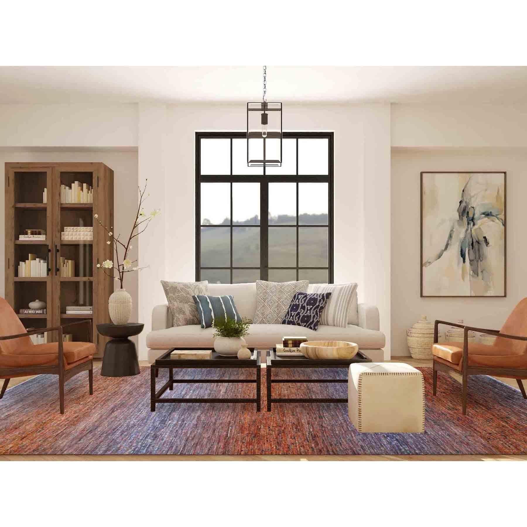 Il s'agit d'un véritable tapis d'Orient orange, moderne, de la Collection Chiaroscuro, noué à la main, épais et pelucheux, en pure laine. Il a été noué pendant des mois et des mois selon des techniques de tissage séculaires par des artisans
