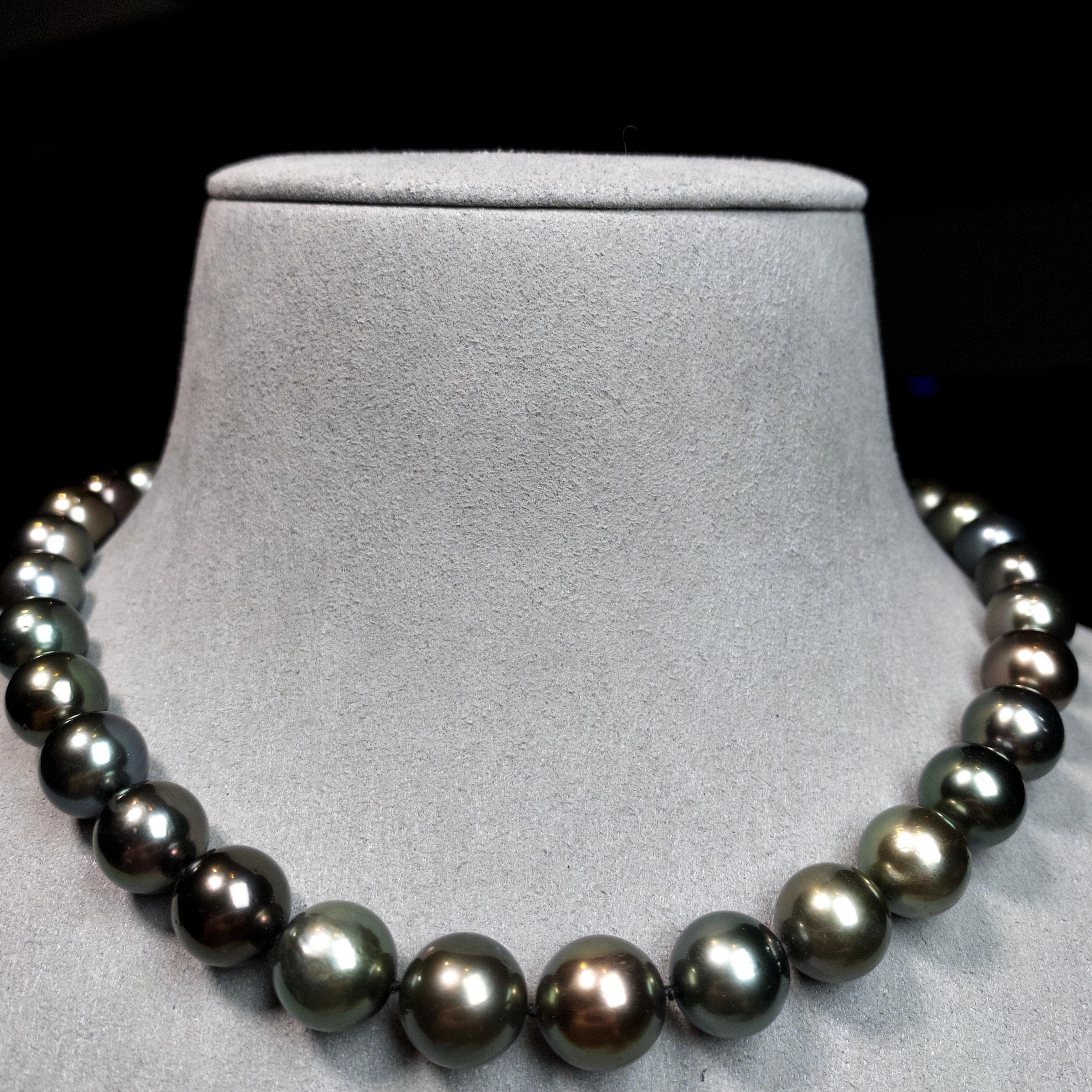 A Strand of Multi Colour Green tone Tahitian pearl necklace with 18K Gold Clasp. Green tone is very sought after in Tahitian pearls and therefore m more valuable. 

A 10.4 mm to 12.7 mm Multi Colour Green Tone Tahitian Pearl Necklace
It consists of