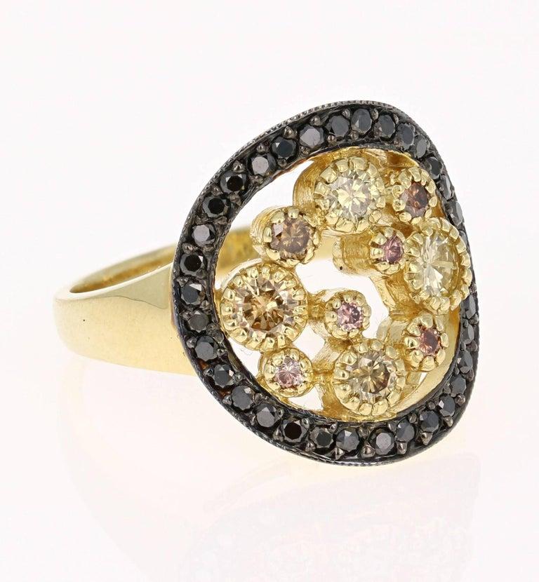 Gorgeous Black Diamond and Natural Fancy-Colored Diamond Cocktail ring. 
This ring has 10 Natural Fancy-Colored Diamonds floating in the center of the ring that weigh 0.65 carats and are surrounded by 34 Round Black Diamonds that weigh 0.39 carats. 