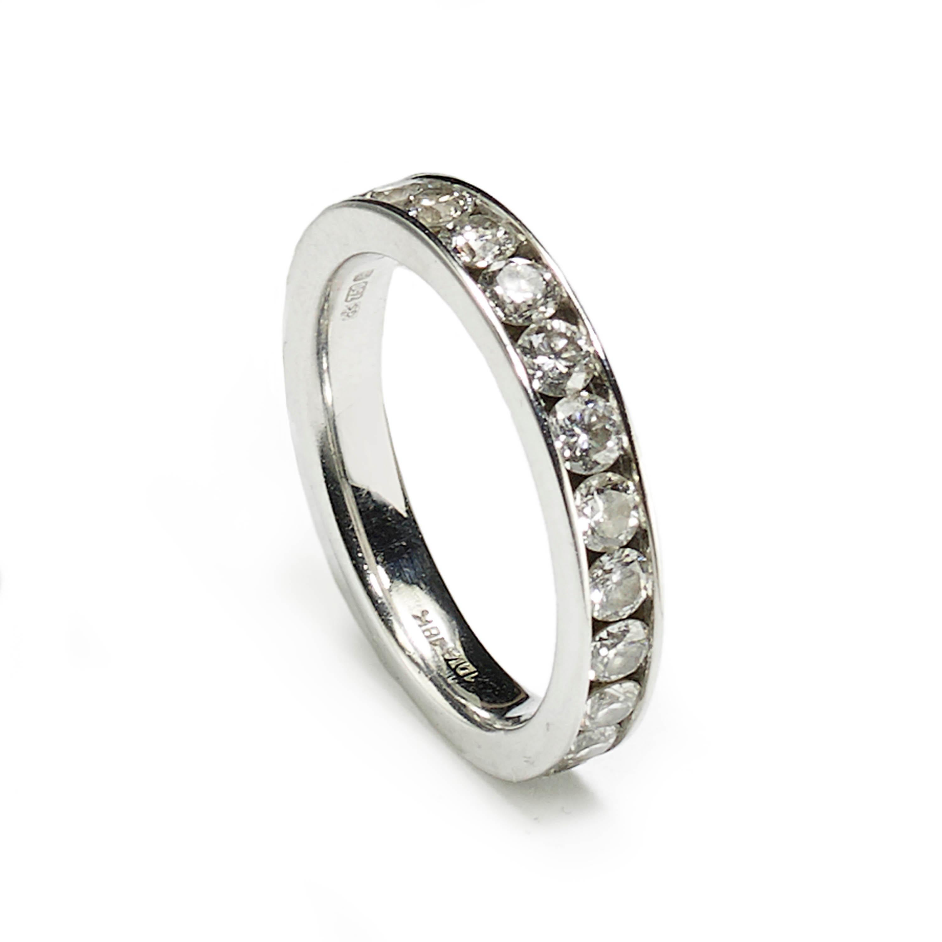 A diamond set half eternity ring, round brilliant-cut diamonds, weighing an estimated total of 1.04ct, in our opinion the colour and clarity are G-H, VS, in a channel setting, mounted in 18ct white gold.