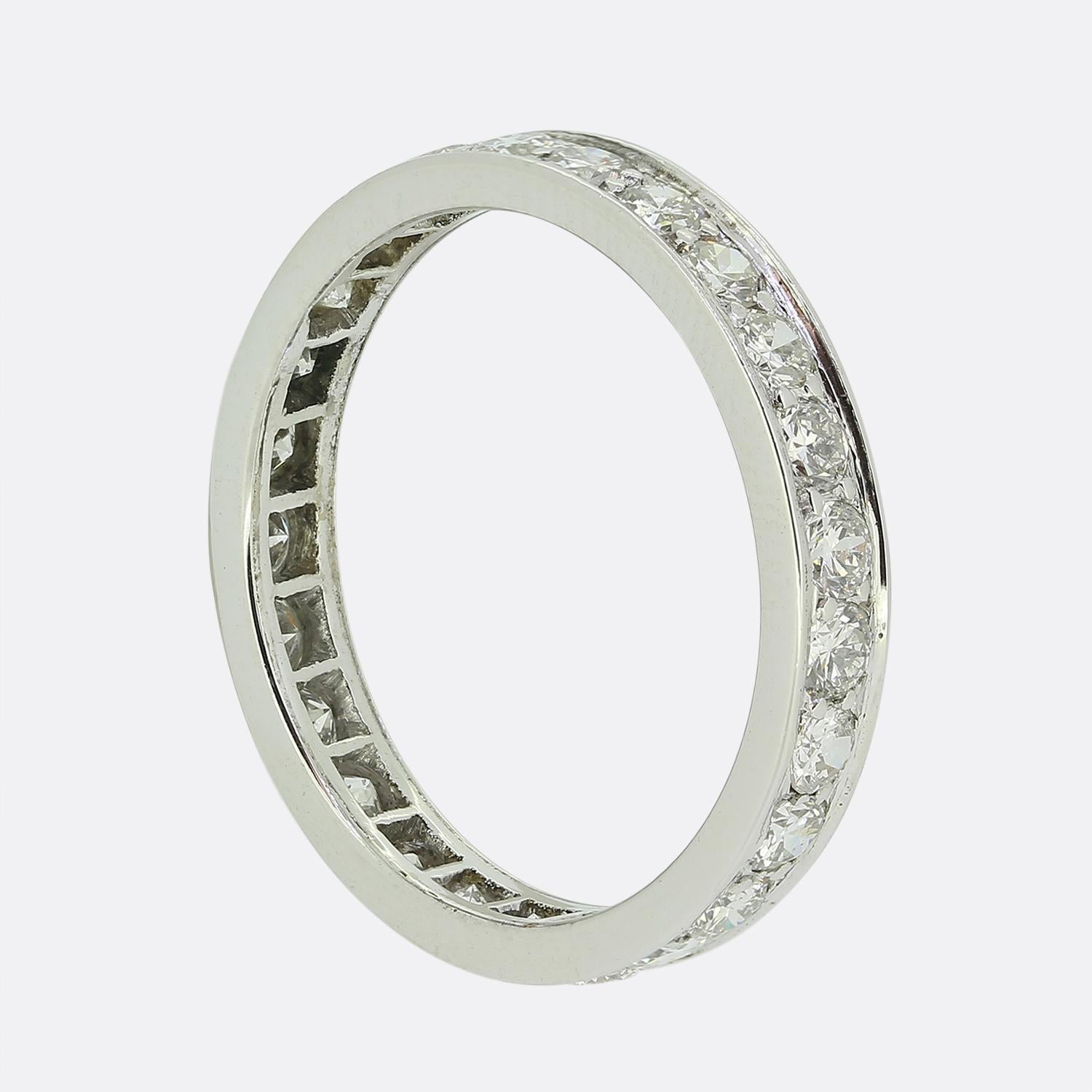 Here we have a platinum band ring featuring a continuous row of round faceted white diamonds. Each stone has been individually claw set amidst a channelled bordering above and below, creating a seamless and elegant look.

Condition: Used (Very