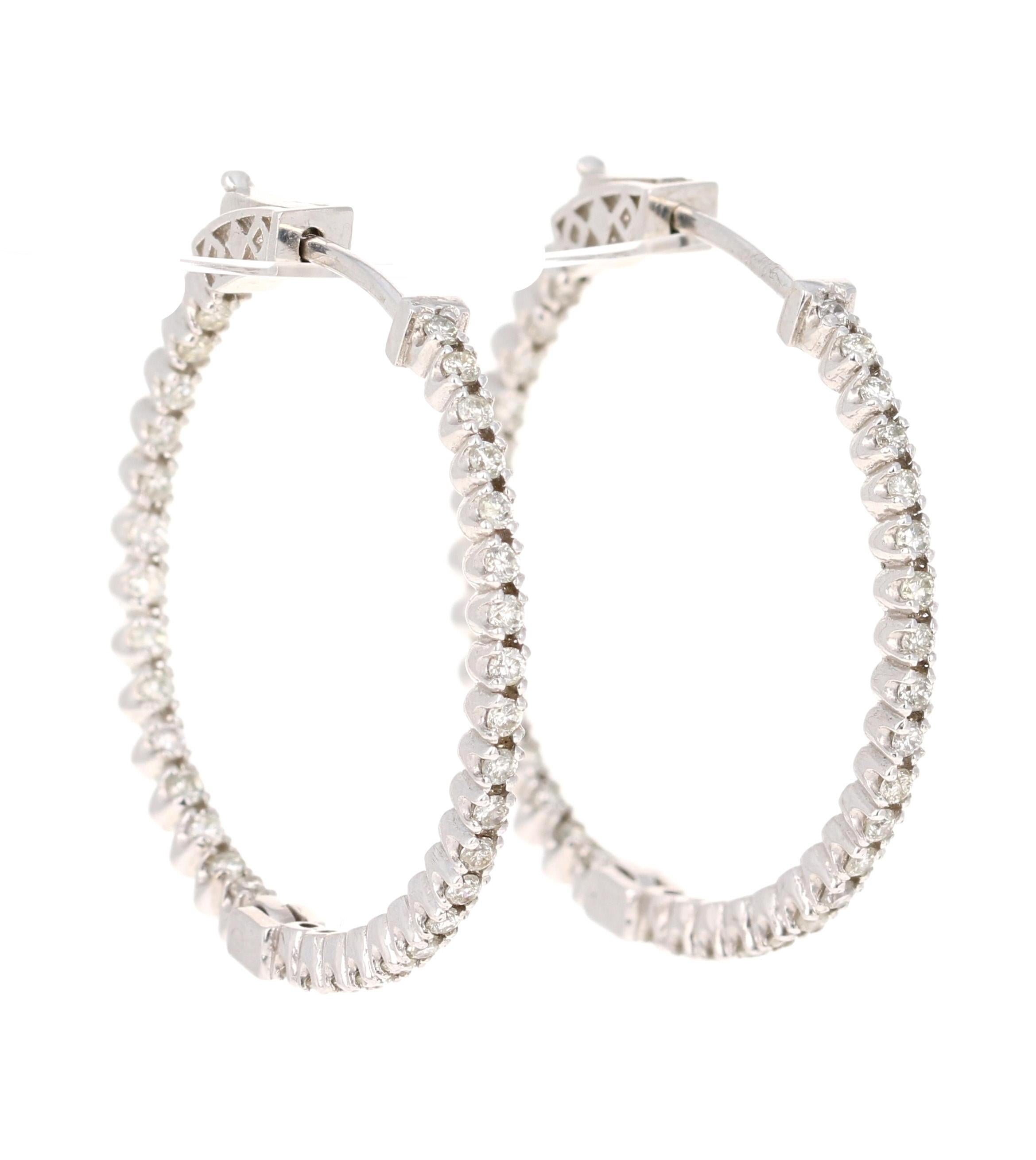 These beautiful and simple earrings are 68 Round Cut Diamonds that weigh 1.04 Carats. 

The hoops are set in 14 Karat White Gold and weigh approximately 6.2 grams. 

The hoops are 1.25 inches.