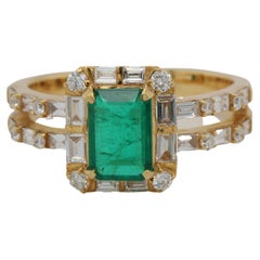1.04 Carat Emerald and Diamond Solitaire Ring in 18 Karat Gold
