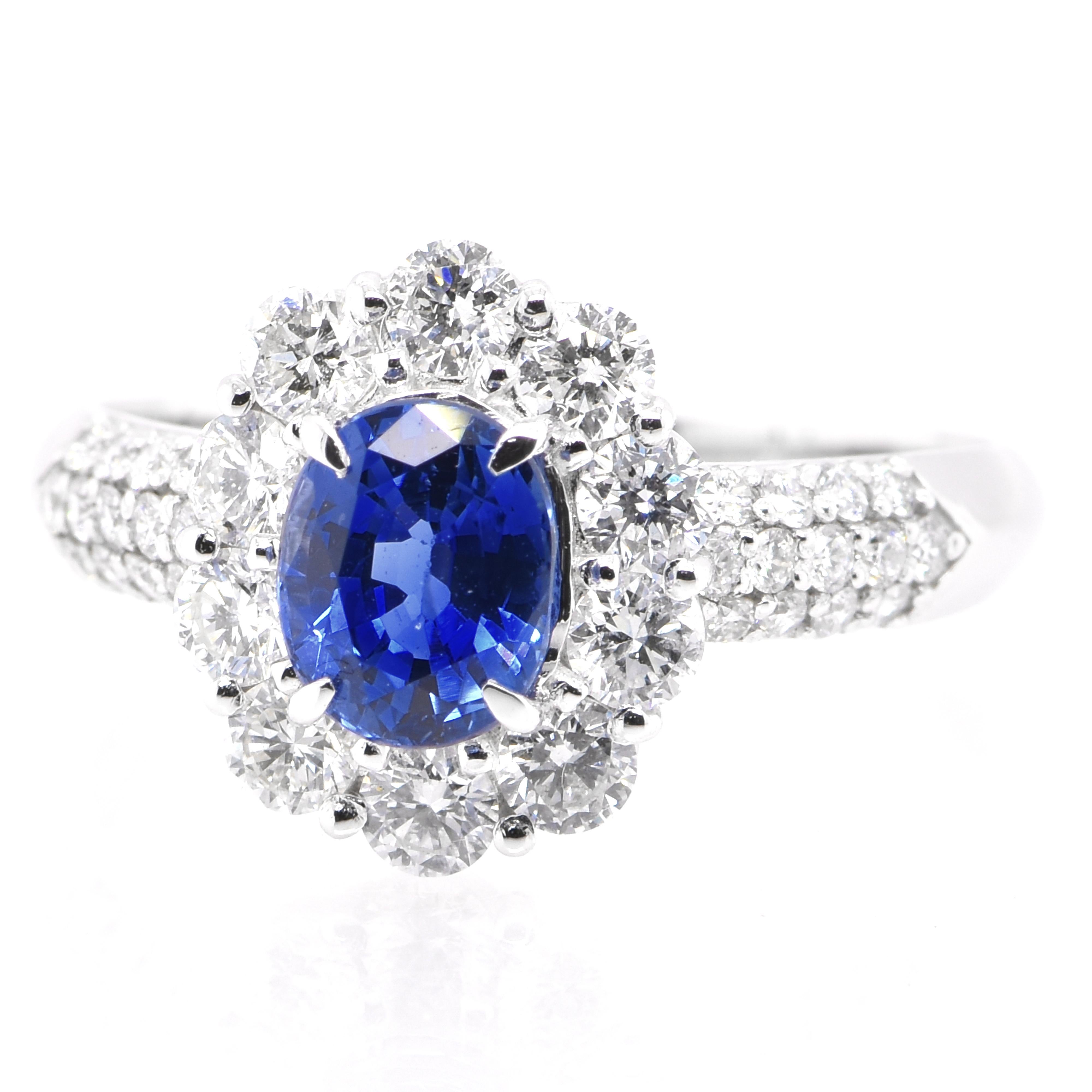 A beautiful ring featuring a 1.045 Carat Natural Blue Sapphire and 0.77 Carats Diamond Accents set in Platinum. Sapphires have extraordinary durability - they excel in hardness as well as toughness and durability making them very popular in jewelry.