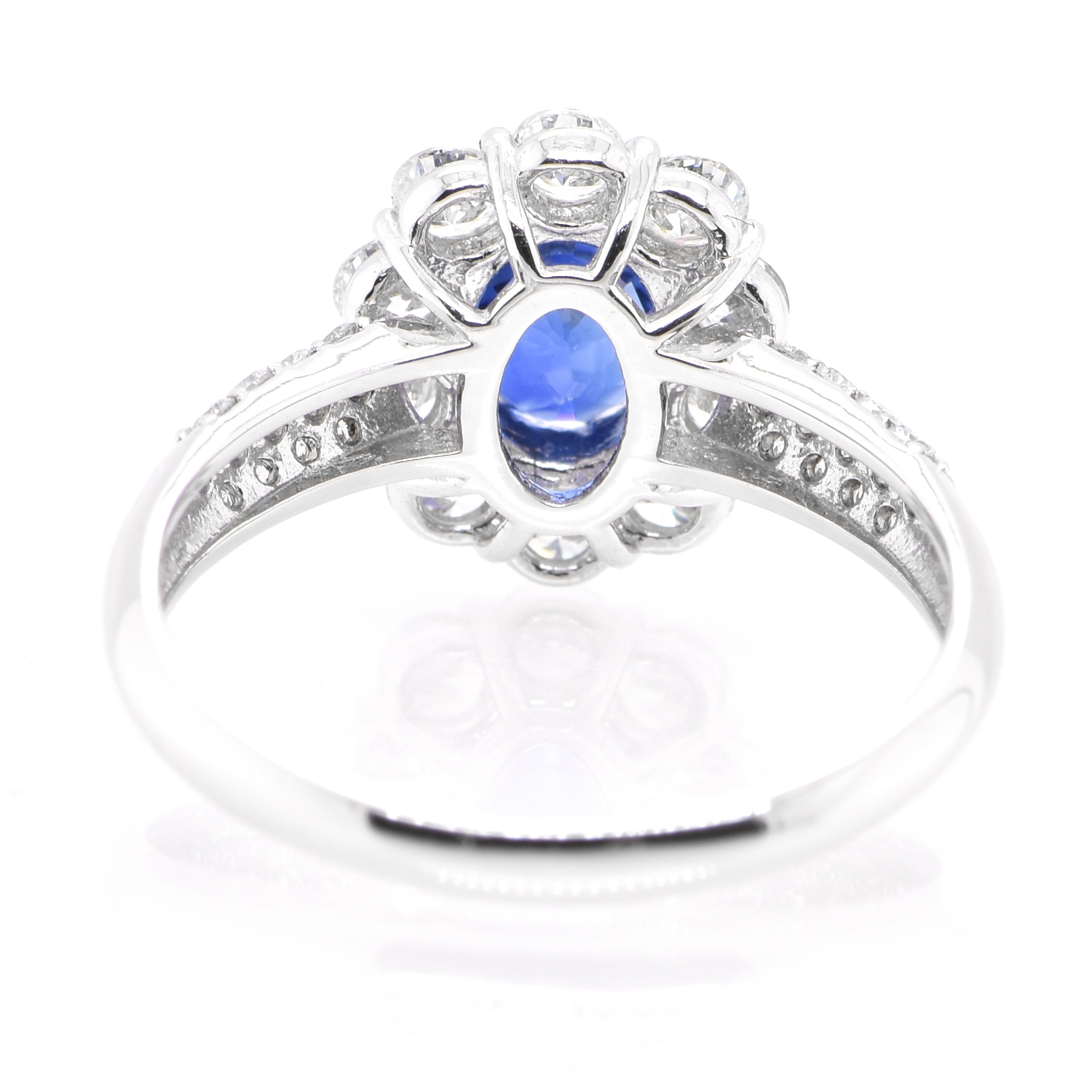 Modern 1.04 Carat Natural Blue Sapphire and Diamond Halo Ring Set in Platinum