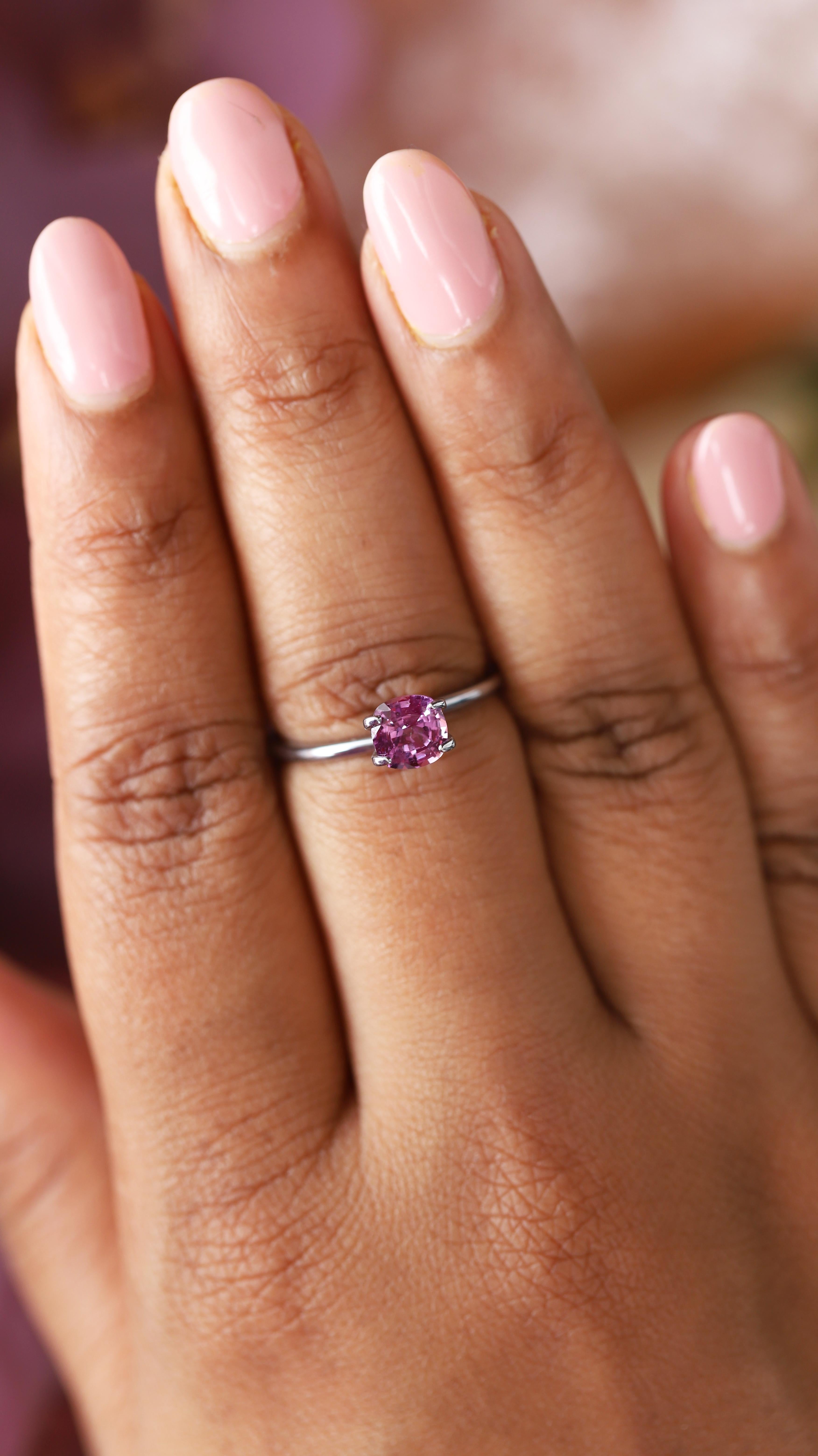 In a fascinating fusion of pink and purple, this natural sapphire is the color of cherished orchid blossoms, displaying a predominantly purplish hue with subtle pink undertones - unique and hypnotic! The gem’s clarity is impeccable, a rare and