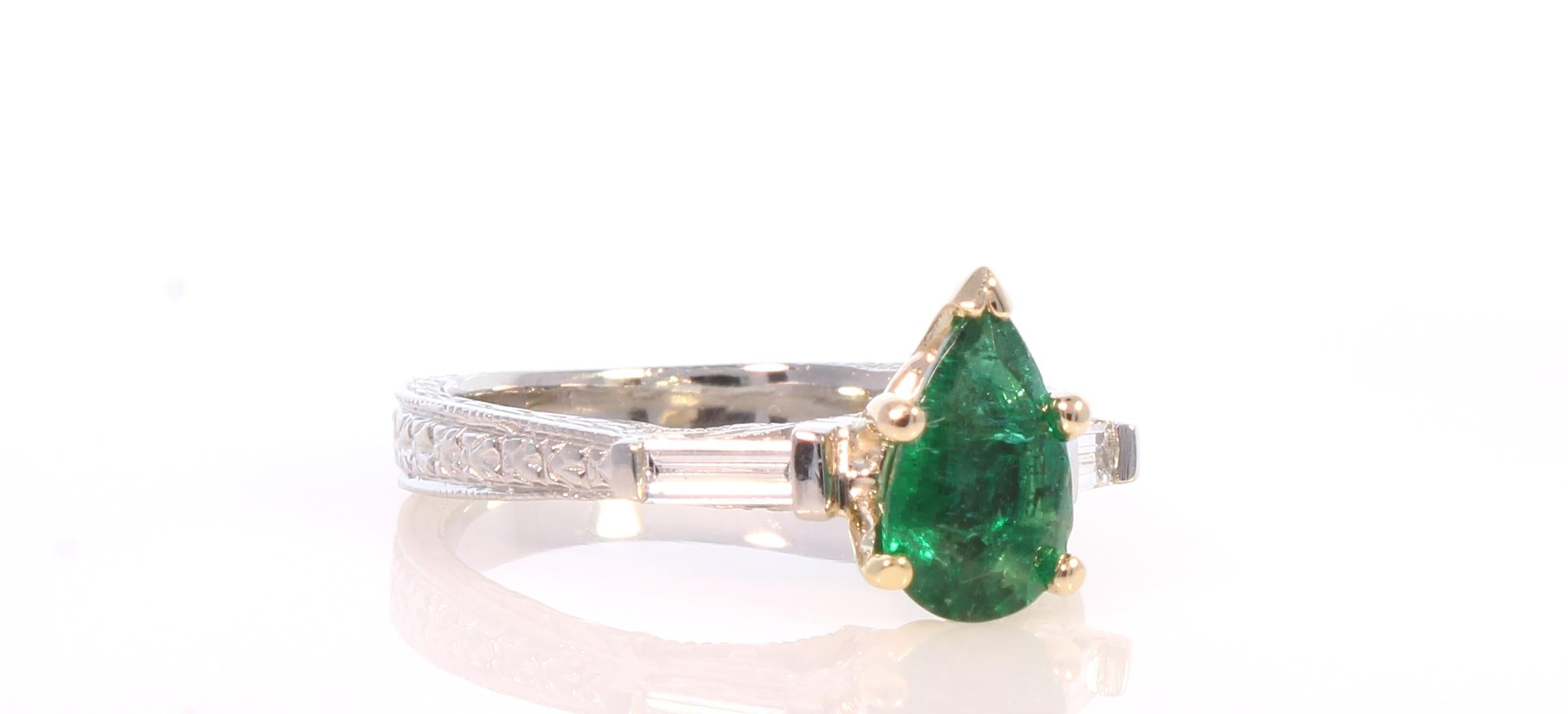 green emerald pear shaped ring