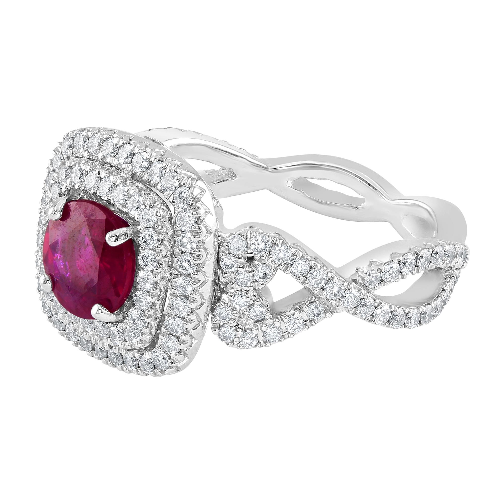 1.04 carat Ruby, surrounded by double halo round diamonds. Underneath the Ruby, there is a gallery with beautiful designs, including a single round white diamond in each corner. The beautiful crossover shank is embellished with diamonds on each
