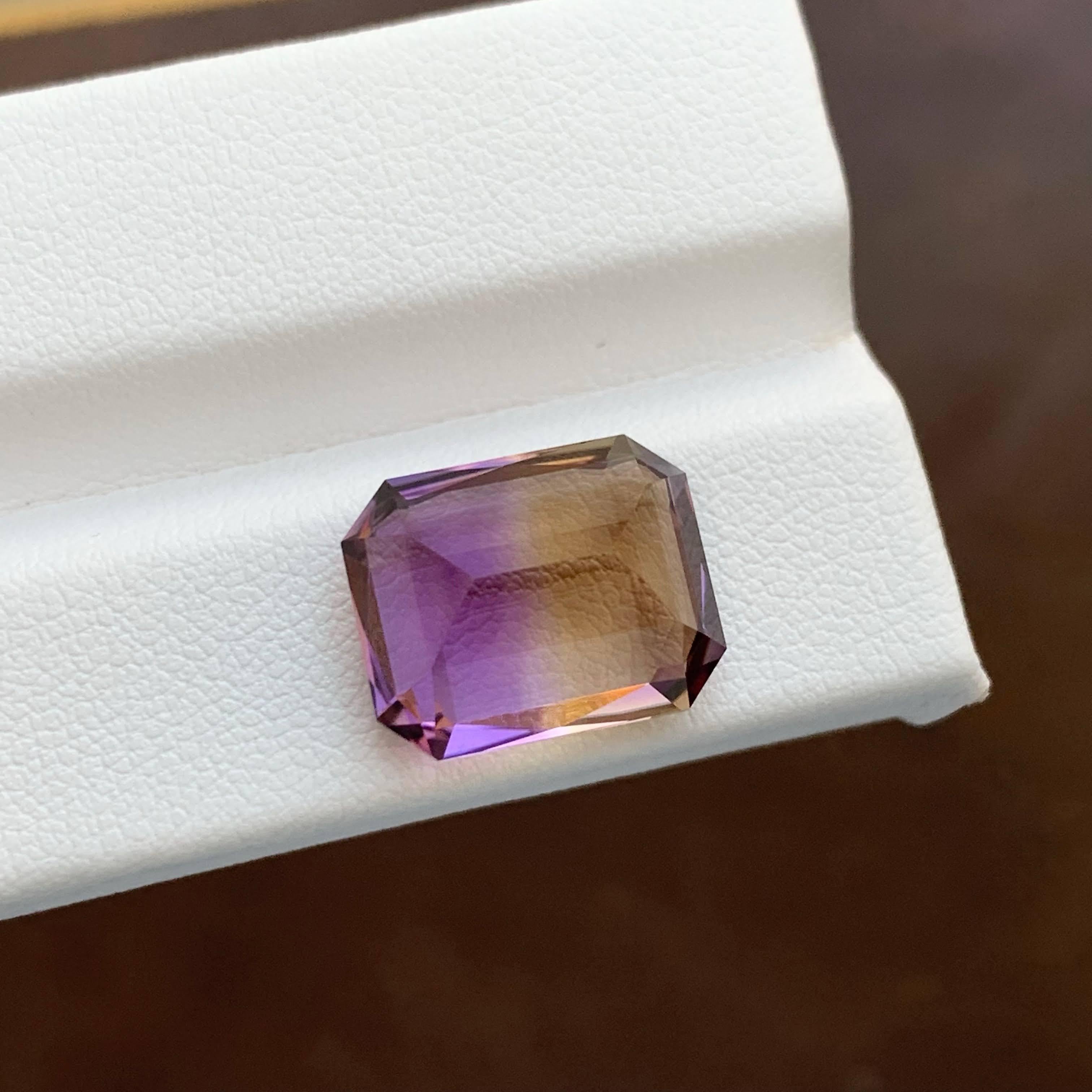 Weight 10.40 carat 
Dimensions 14.5x11.7x8.9mm
Treatment None 
Origin Bolivia
Clarity Loup Clean 
Shape Cut Fancy Emerald 




This exquisite 10.40-carat natural Ametrine is a rare and captivating gemstone, admired for its unique fusion of colors.