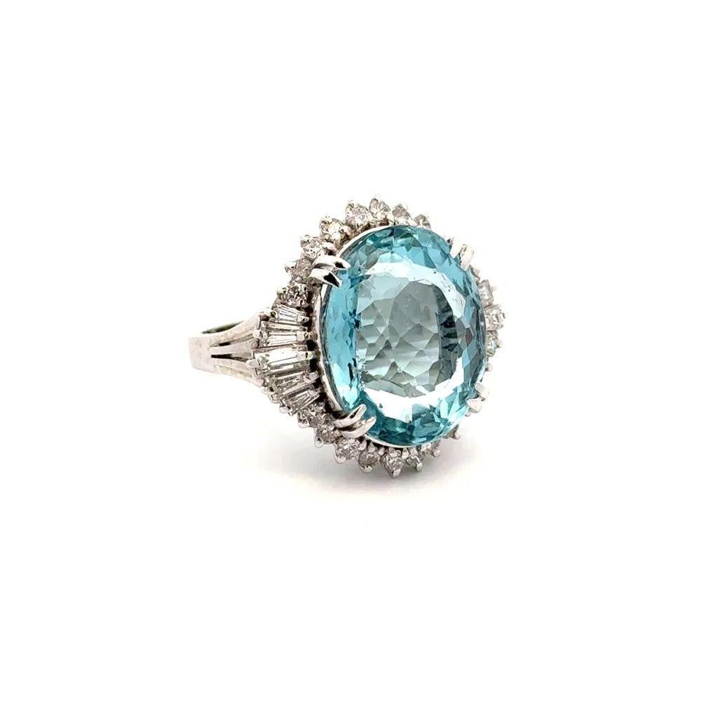 Simply Beautiful! Finely detailed Aquamarine and Diamond Platinum Vintage Ballerina Ring. Centering a securely nestled Hand set Oval Aquamarine Gemstone, weighing approx. 10.40 Carats. Surrounded by dazzling Baguette and Round Brilliant Cut
