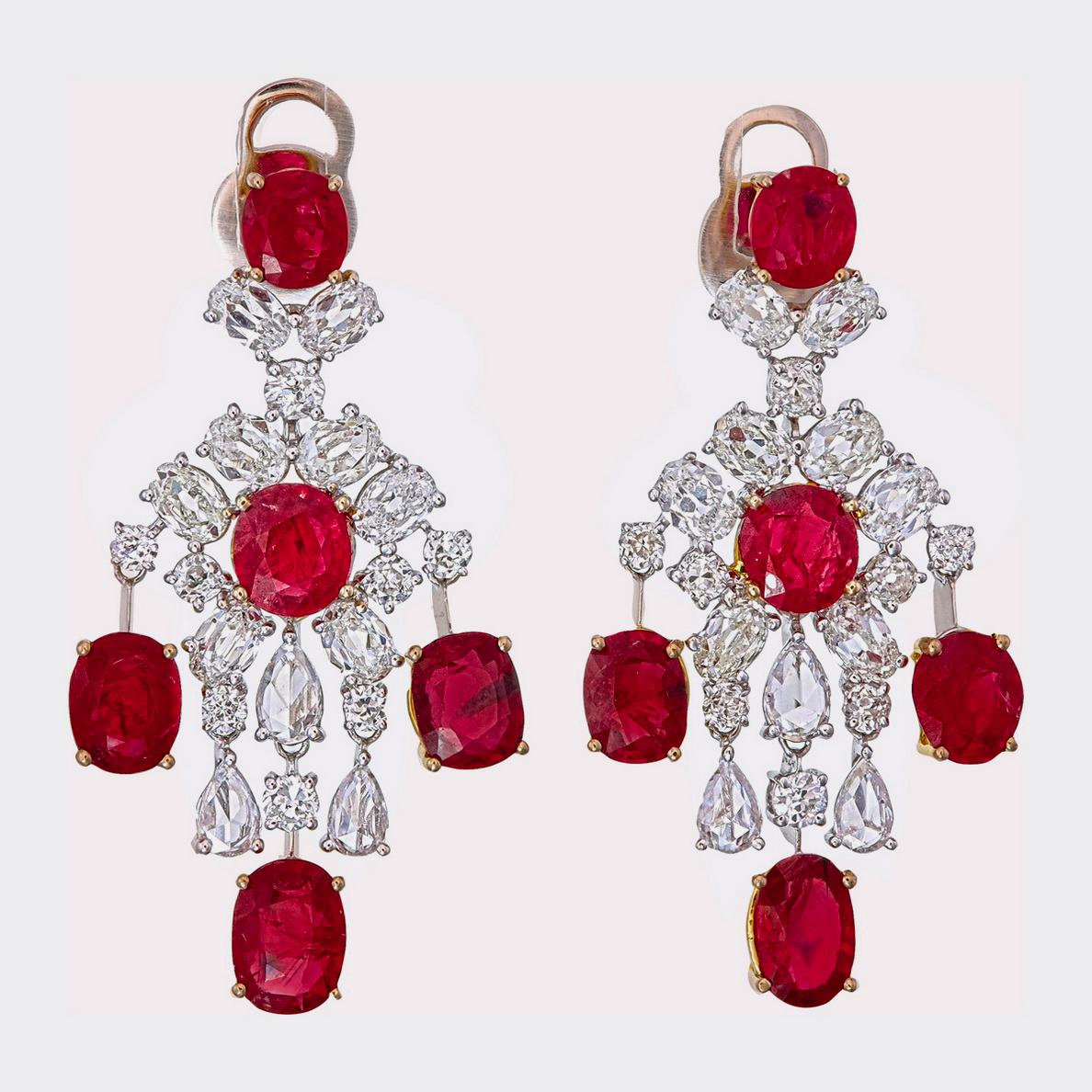 These luxurious ruby and diamond earrings are handcrafted by Rewa jewels in 18 karat white gold.

The main highlights are the 10 pieces untreated Burmese rubies weighing approximately 10.43 carat in all.

Additionally it has 6 pieces of pear shaped