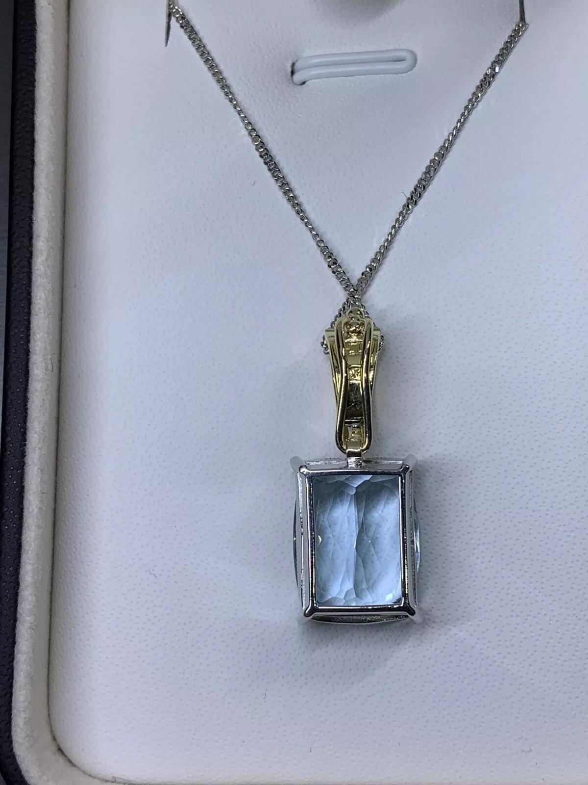 10.46ct Aquamarine and diamonds pendant pearl clasp in 18k yellow and white gold.

Multifunction Aquamarine and diamond pendant necklace can be adjusted on the pearl necklace.

Gorgeous Natural aquamarine emerald shape total weight 10.26ct

Diamond