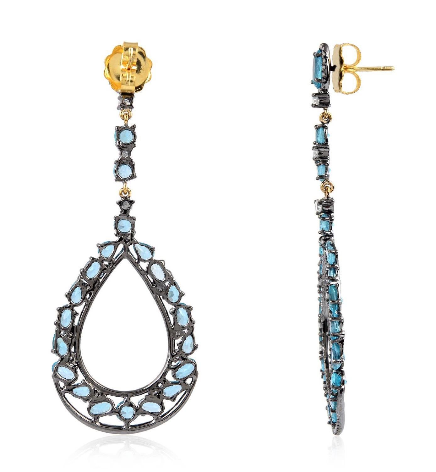 Handcrafted from 18-karat gold & sterling silver, these beautiful drop earrings is set with 10.48 carat Apatite & 1.66 carat sparking diamonds in blackened finish. 

FOLLOW  MEGHNA JEWELS storefront to view the latest collection & exclusive pieces. 