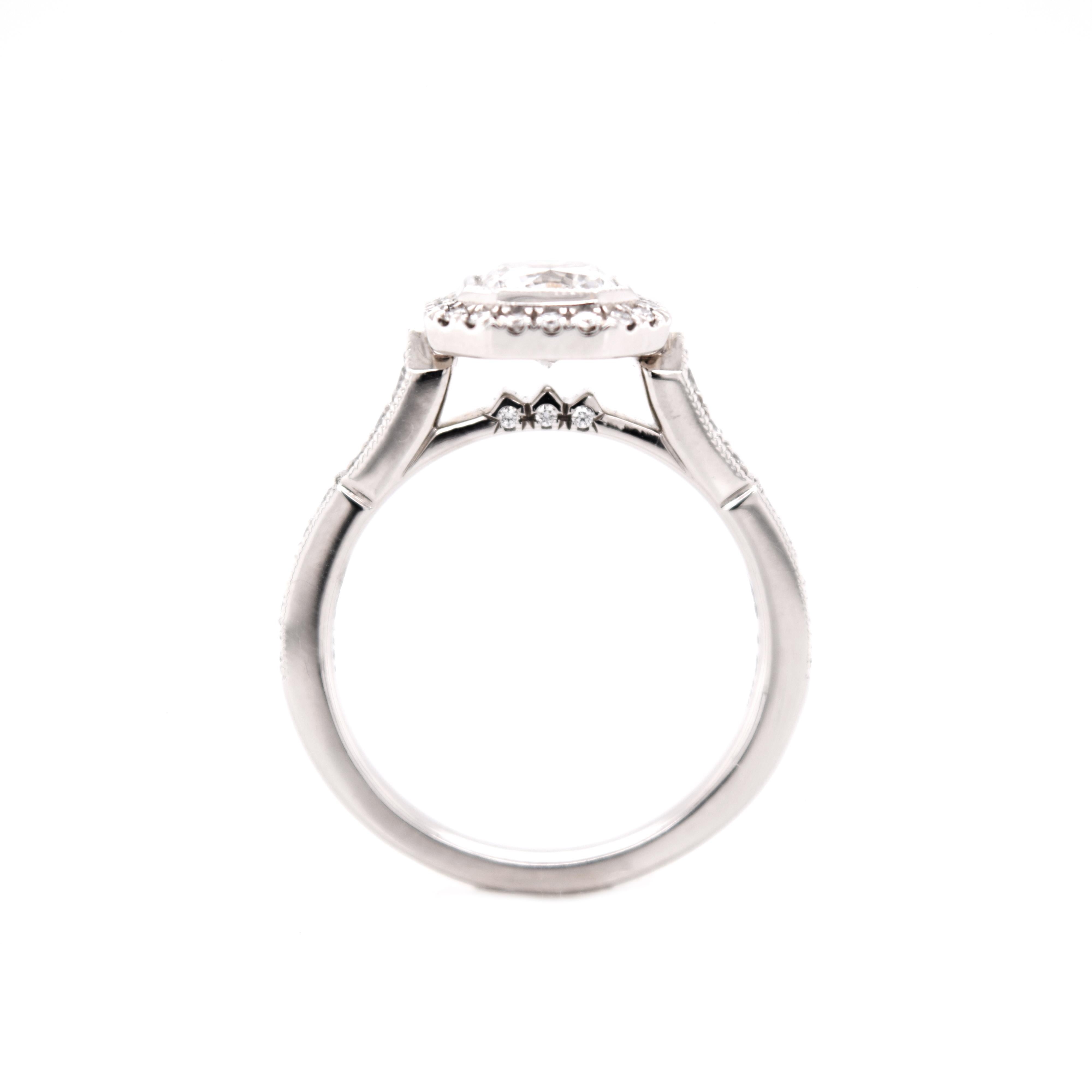1.048 E color SI2 Dream [square radiant] diamond by Hearts on Fire set in this Art Deco Style ring surrounded by 36 Hearts on Fire Diamonds .27 Carat Total Weight G-H / VS-SI.
DRM is inscribed with # 12417. 
A diamond wedding band will fit perfectly