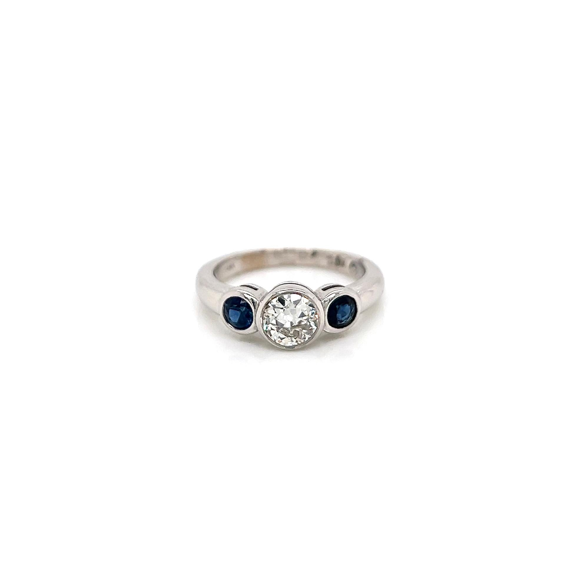 1.04Carat Sapphire Diamond Engagement Ring

-Metal Type: 18K White Gold
-0.60Carat Old European Cut Natural Diamond Center 
-0.44Carat Round Side Blue Sapphires
-Size 6.0

Made in New York City