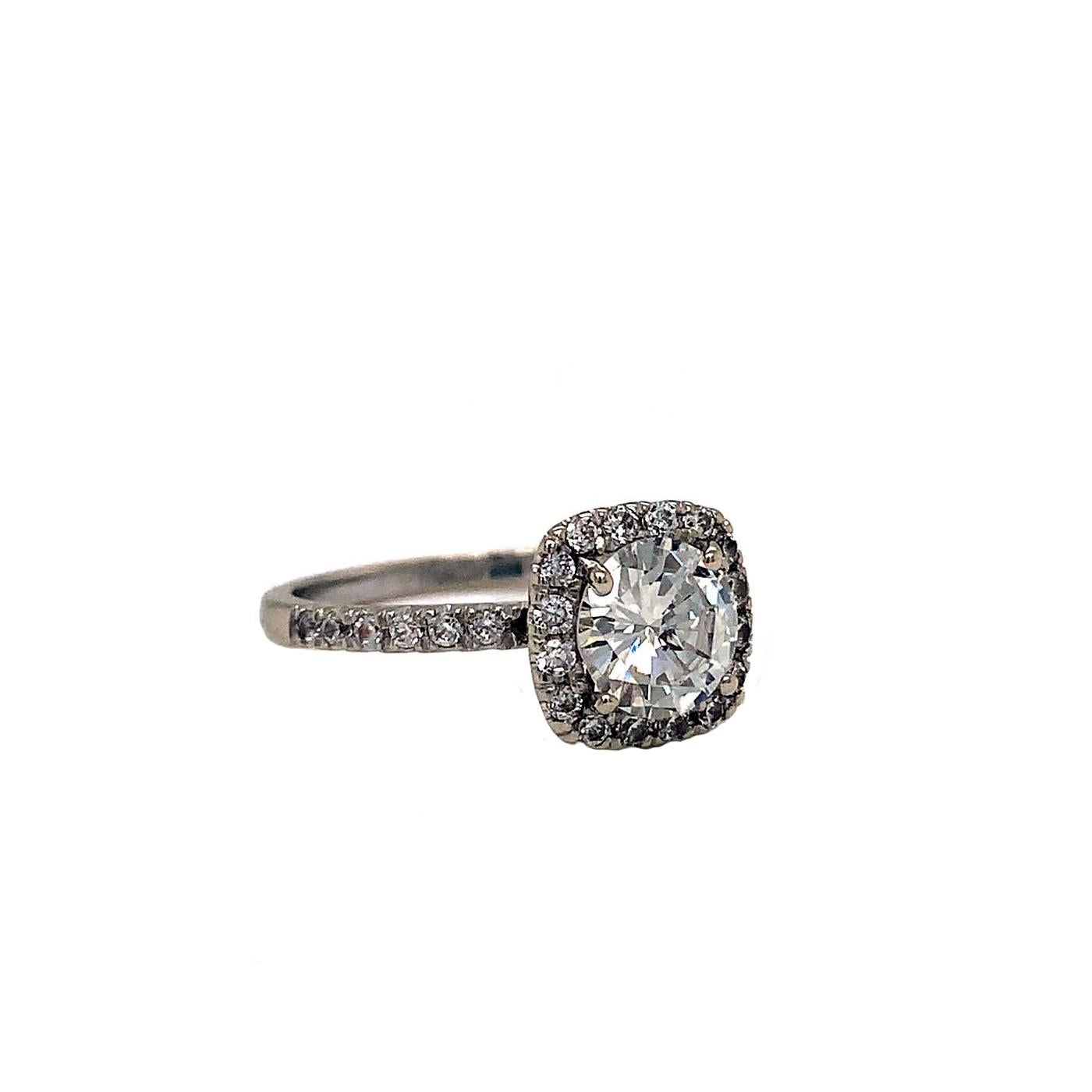 Timeless and elegant, The round brilliant cut diamond is a frame with a Halo-shaped diamond. Adding to its appeal, the halo diamond and shank draw attention and add sparkle to the center stone. This outstanding engagement ring is masterfully
