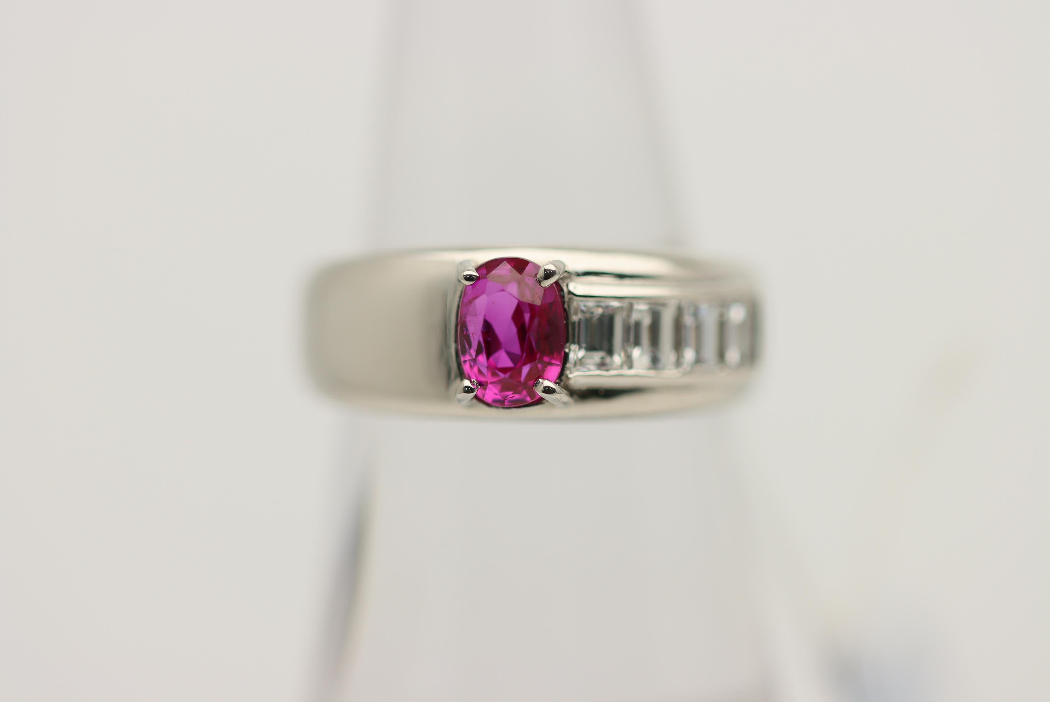 Here we have a finely made platinum ring featuring a GIA certified Burmese ruby. The ruby weighs 1.04 carats and has a bright and vibrant pinkish-red color which is classic for fine stones of this origin. It is complemented by 0.48 carats of bright