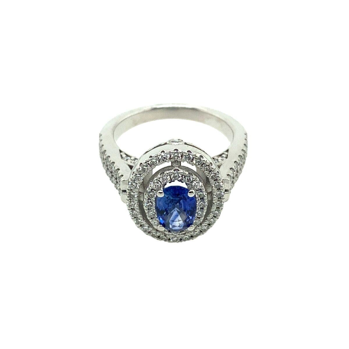 New 1.04ct Certified Natural Ceylon Sapphire Ring, Surrounded by 0.87ct Diamonds

Additional Information:
Set in 18ct White Gold
Total Diamond Weight: 0.87ct
Diamond Colour: F
Diamond Clarity: VS
Total  Weight: 9.7g
Ring Size: M1/2 (can be