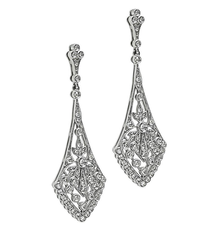 This is an elegant platinum chandelier earrings. The earrings feature sparkling round cut diamonds that weigh approximately 1.04ct. The color of these diamonds is G-H with VS clarity. The earrings measure 46mm by 16mm and weigh 9.7 grams. The