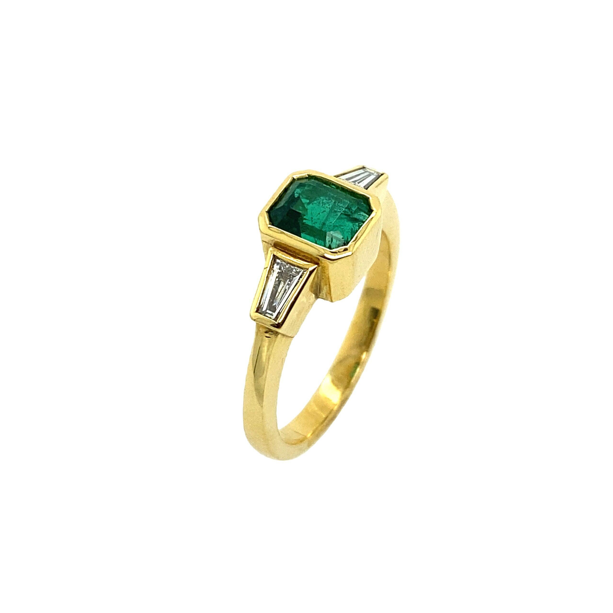 18ct Gold Fine Quality 1.04ct Emerald Cut Emerald Ring Tapered Baguettes

Additional Information:
Total Diamond Weight: 0.33ct Diamond Colour: F
Diamond Clarity: VS
Total Weight: 5.2g
Ring Size: M