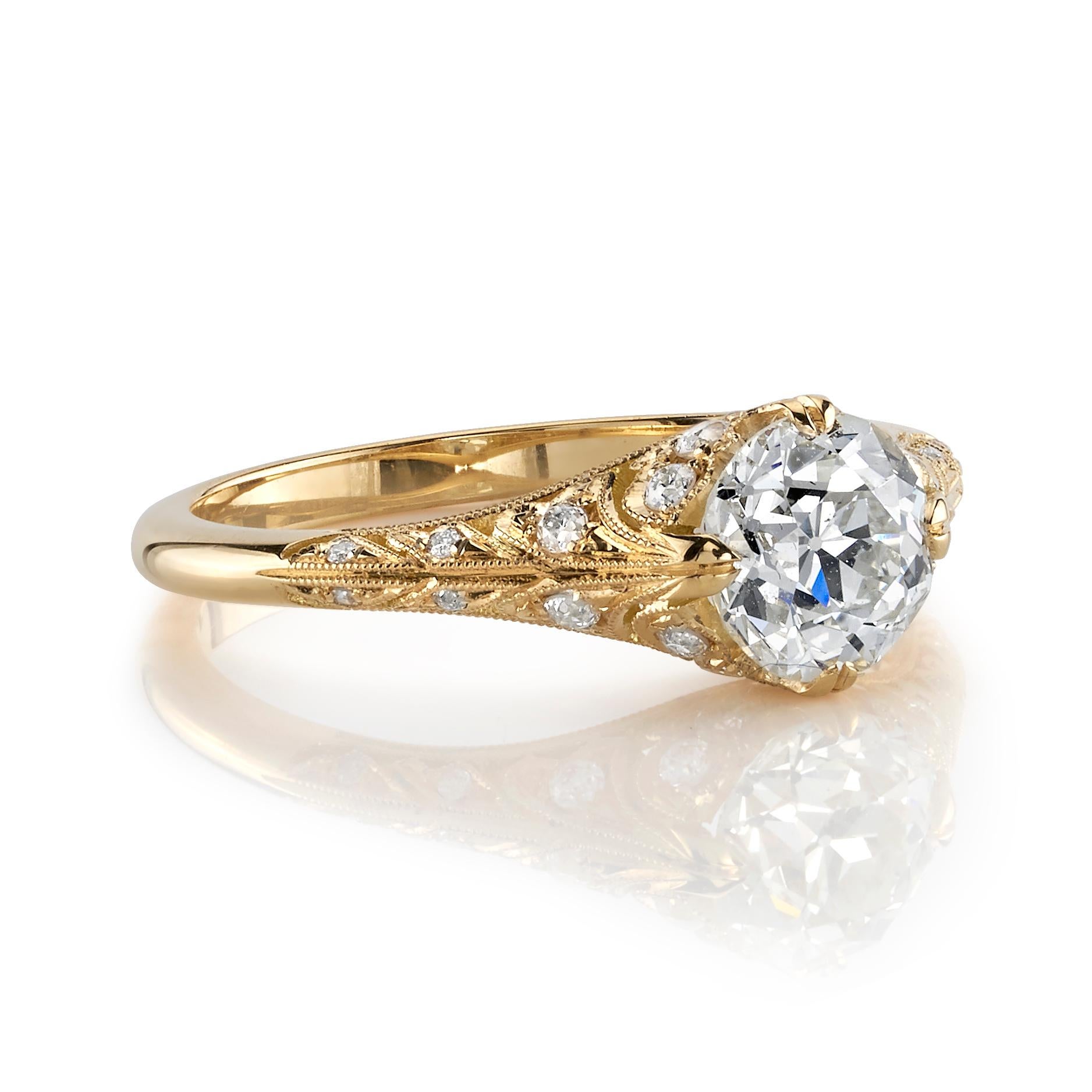 1.04ct K/SI1 GIA certified old European cut diamond with 0.18ctw accent diamonds set in a handcrafted 18K yellow gold mounting. Ring is currently a size 6 and can be sized to fit.