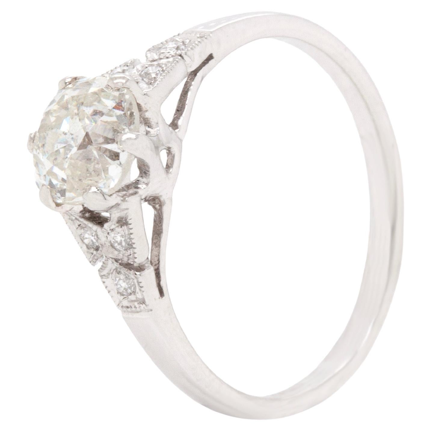 Introducing this stunning engagement ring featuring a striking 1.04 carat old mine cut diamond at its centre, expertly set in an elegant six claw, open back setting.

The old cut stone is beautifully complemented by a further six round brilliant cut