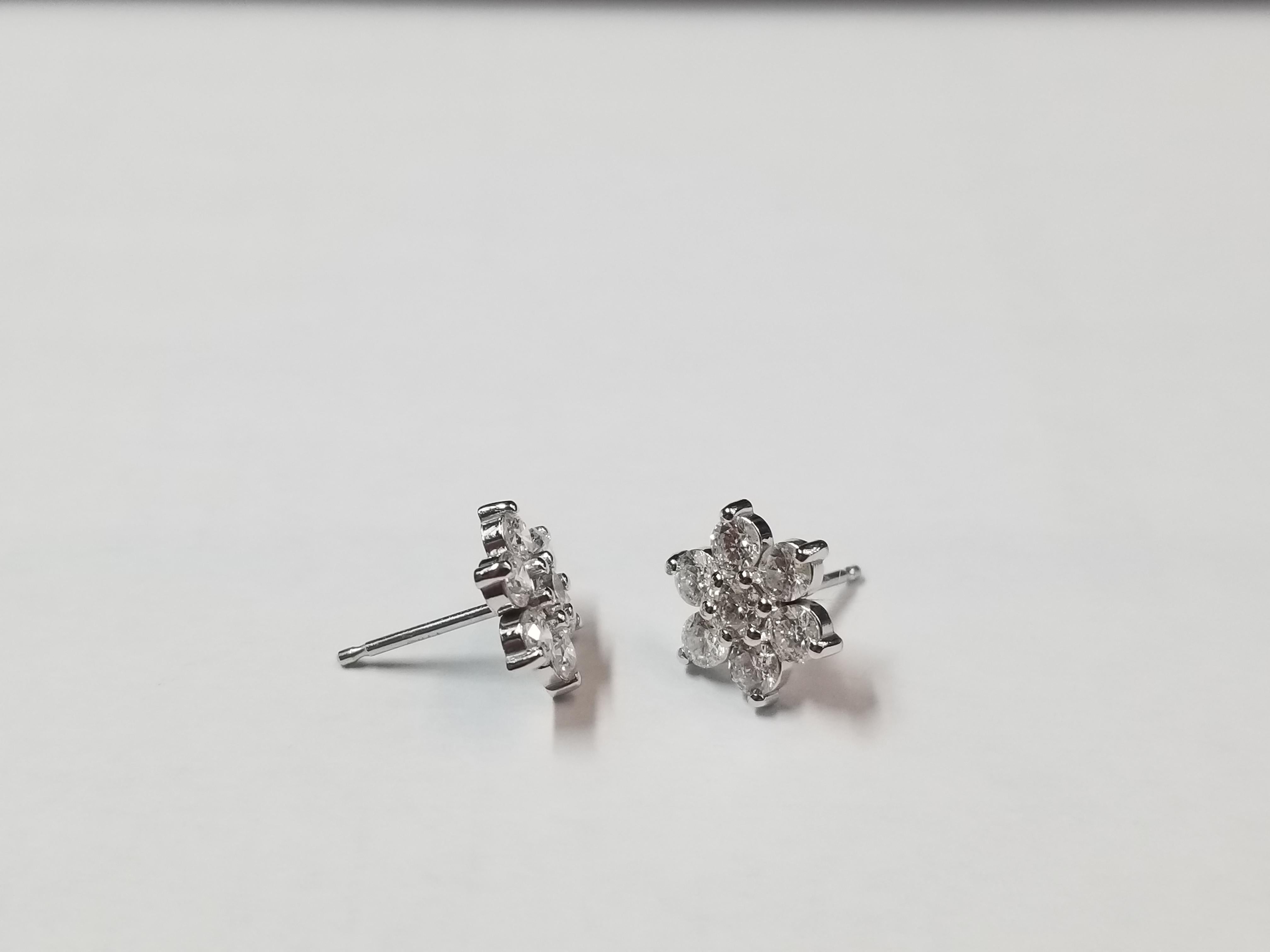 Delicate Flower Cluster Stud Earrings
The earrings are 14K White Gold
There are 1.05 Carats in Diamonds G I1
The studs measure 8.5mm wide.
the earrings weigh 1.37 grams