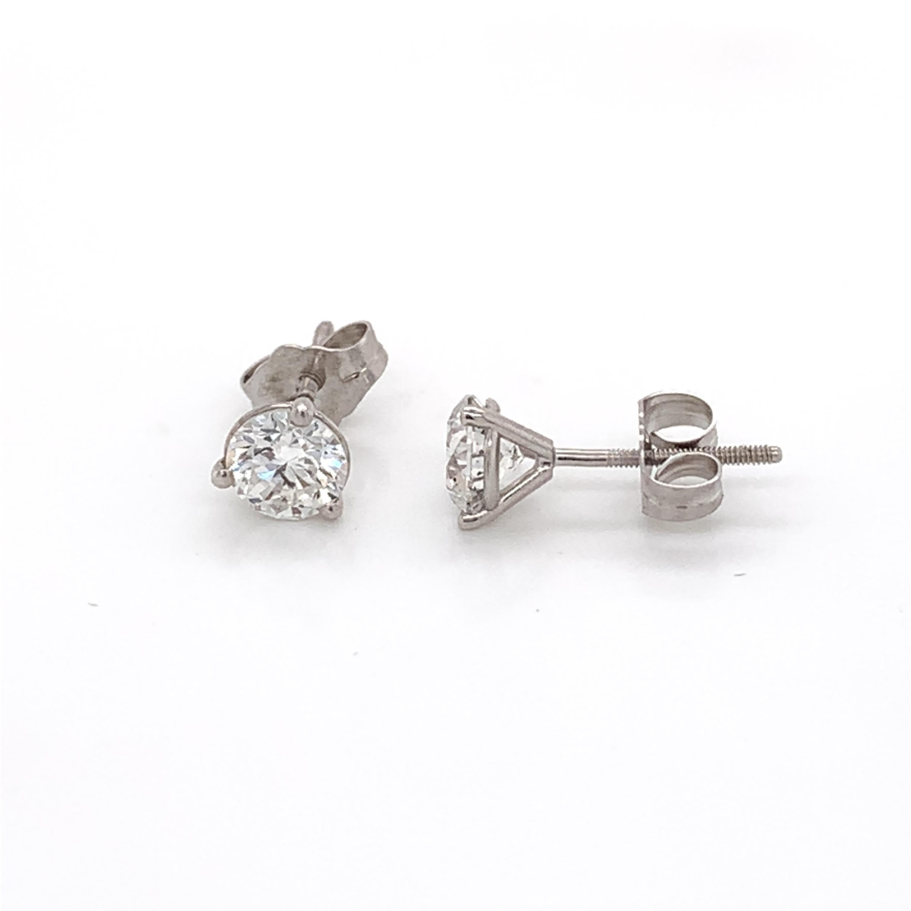 Medium sized diamond stud earrings perfect for everyday. Made with real/natural brilliant cut diamonds. Total Diamond Weight: 1.05 carats. Diamond Quantity: 2 round diamonds. Mounted on 18 karat white gold screw back setting.