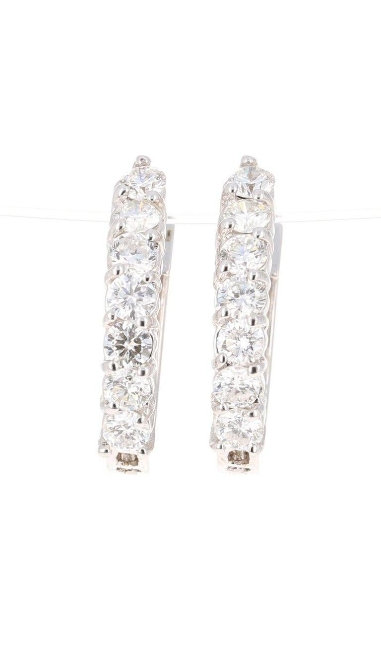 These versatile beauties are great every day earrings or special event earrings.

14 Round Cut Diamonds that weigh 1.05 Carats. Beautifully set on 18 Karat White Gold with an approximate gold weight of 4.1 grams.

(Clarity: SI, Color: F)