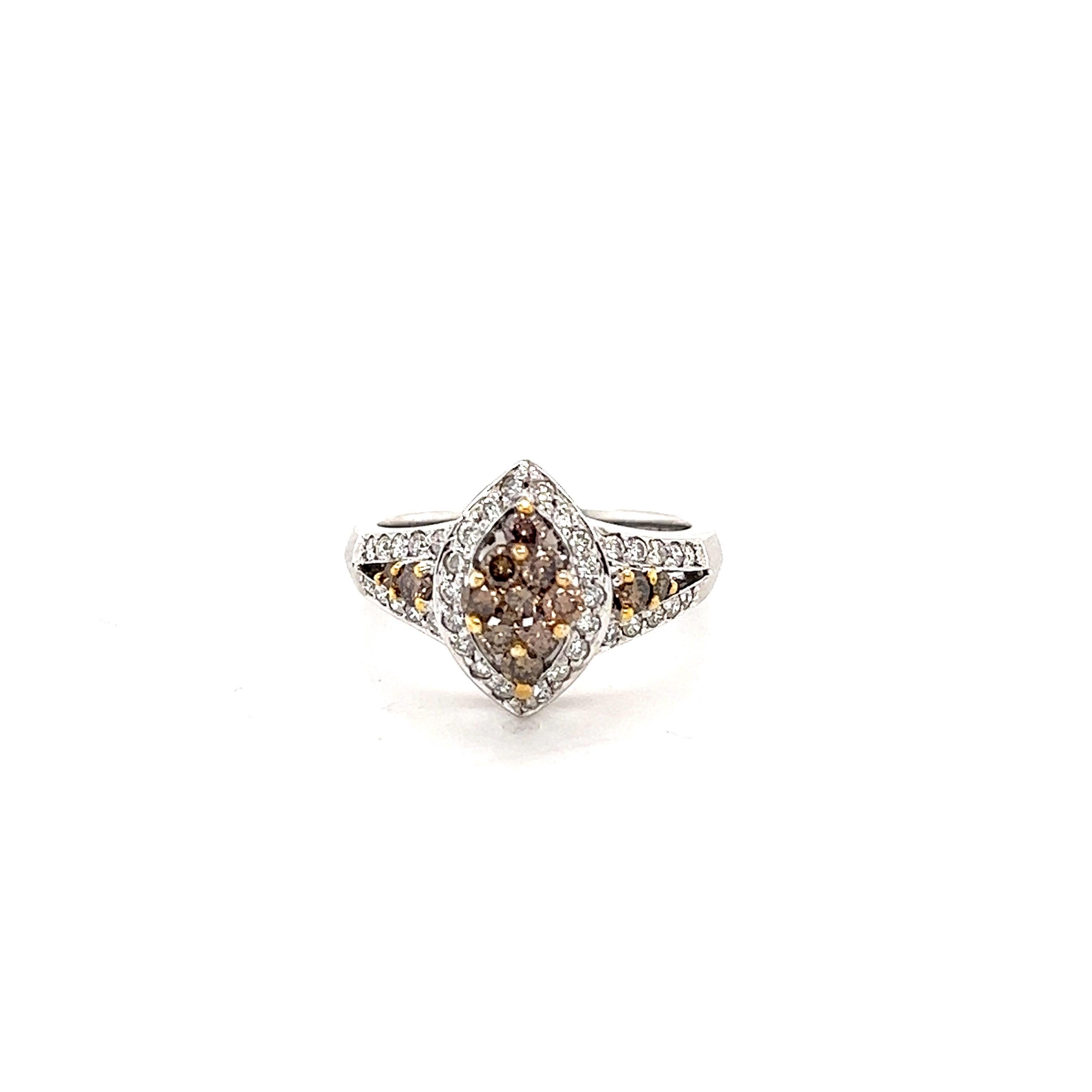 This ring has 13 Brown Natural Diamonds that weigh 0.65 carats and 38 Round Cut Diamonds that weigh 0.40 carats. The total carat weight of the ring is 1.05 carats. 

Curated in 14 Karat Yellow Gold and has an approximate weight of 4.8 grams.

It is