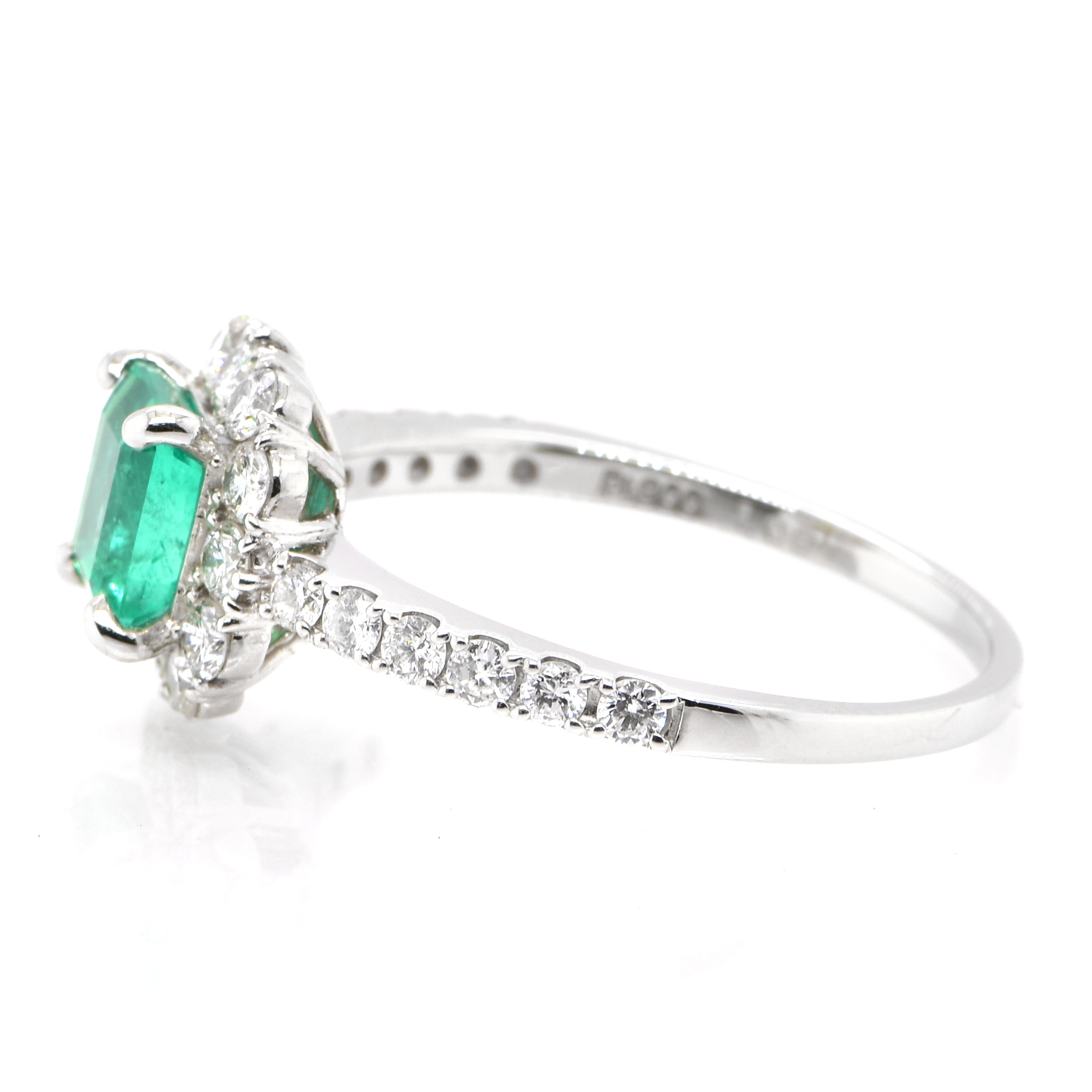 Emerald Cut 1.05 Carat Natural Colombian Emerald and Diamond Halo Ring set in Platinum For Sale