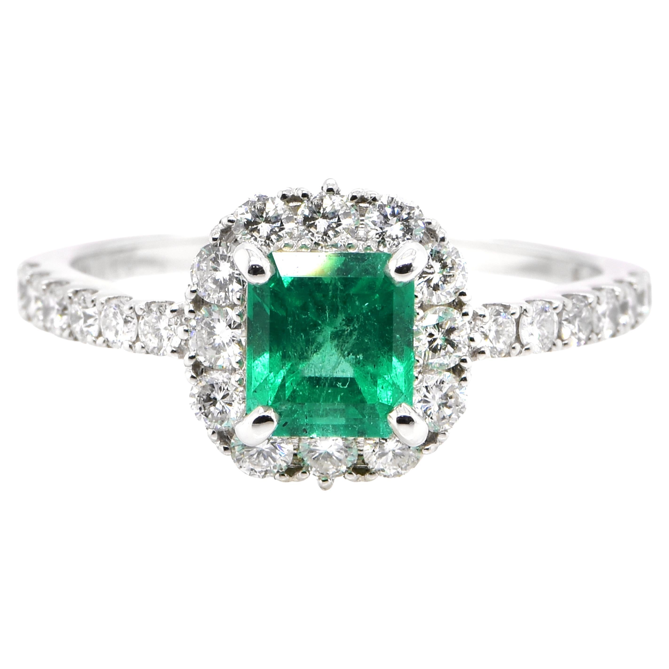 1.05 Carat Natural Colombian Emerald and Diamond Halo Ring set in Platinum