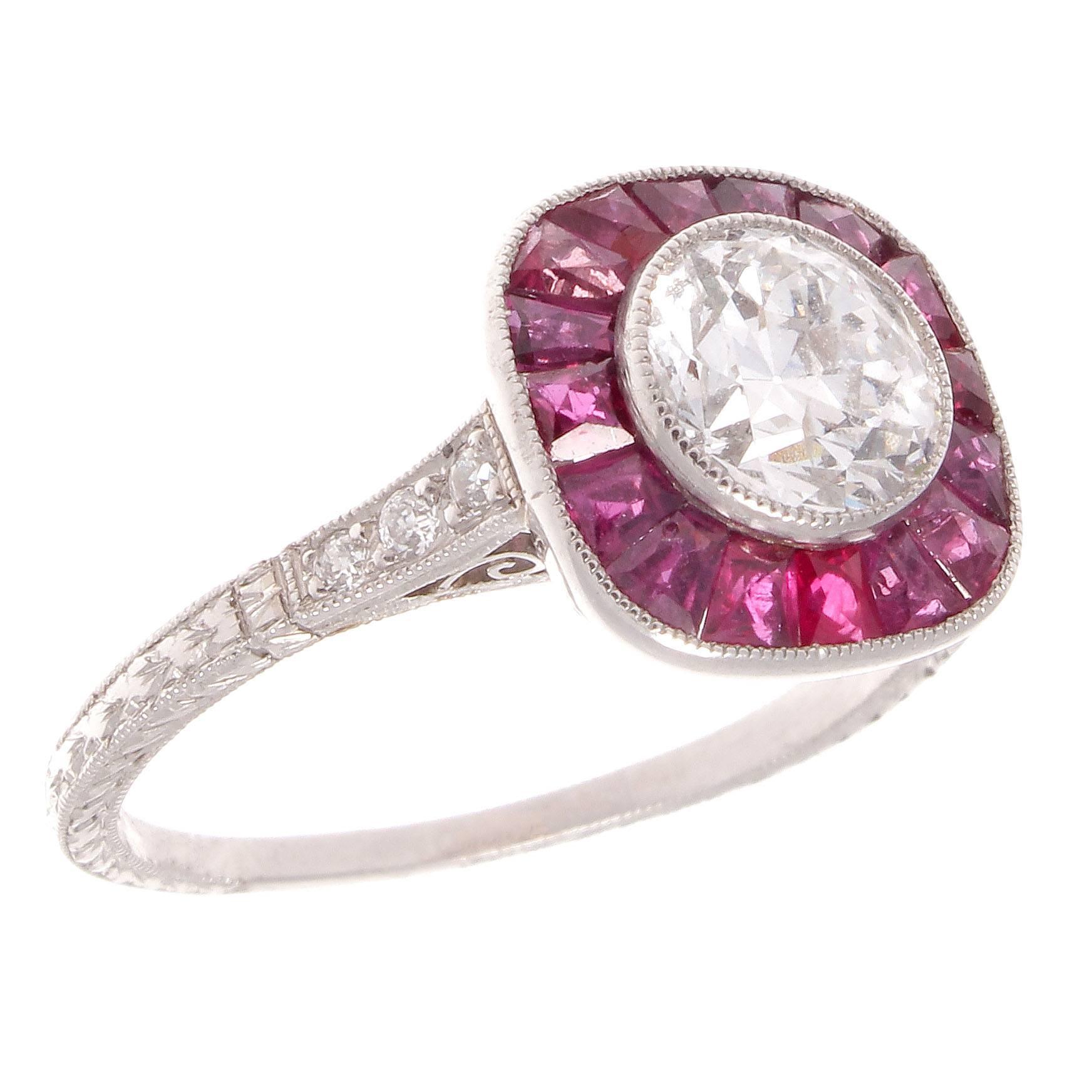 Add some color to your life with this extremely well made Art Deco inspired ring. Featuring a 1.05 carat old European cut diamond that is G color and SI2 clarity. The diamond is surrounded by a halo of 16 well matched sparkling rubies weighing