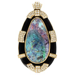 105 Carat Oval Black Opal, Diamond and Black Onyx Pendant  18K Yellow Gold