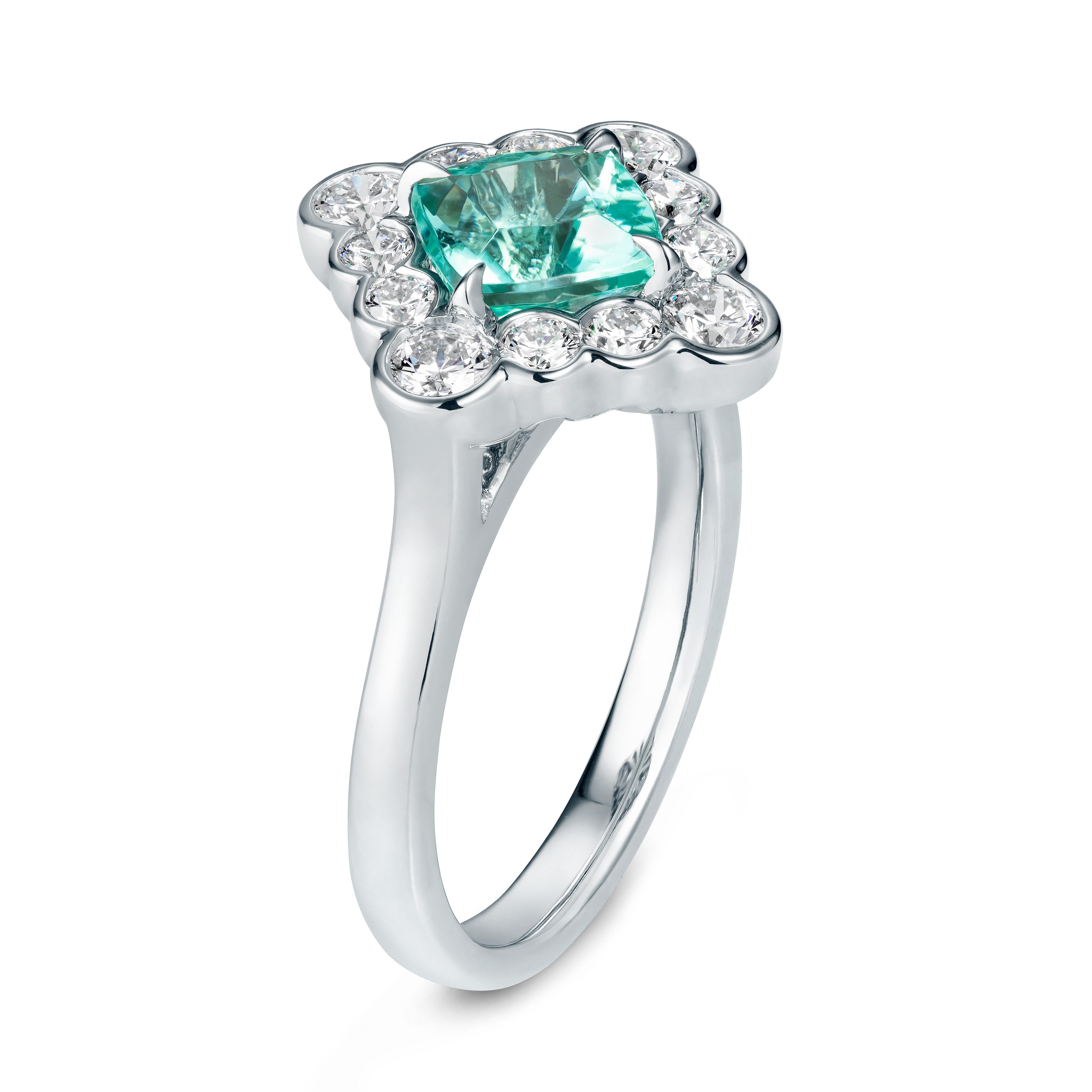 This exceptional piece is a cushion cut paraiba tourmaline diamond engagement ring.  The paraiba centre was sourced from Mozambique.  A paraiba tourmaline piece of jewellery will forever be unique and this wonderful engagement ring is no exception! 