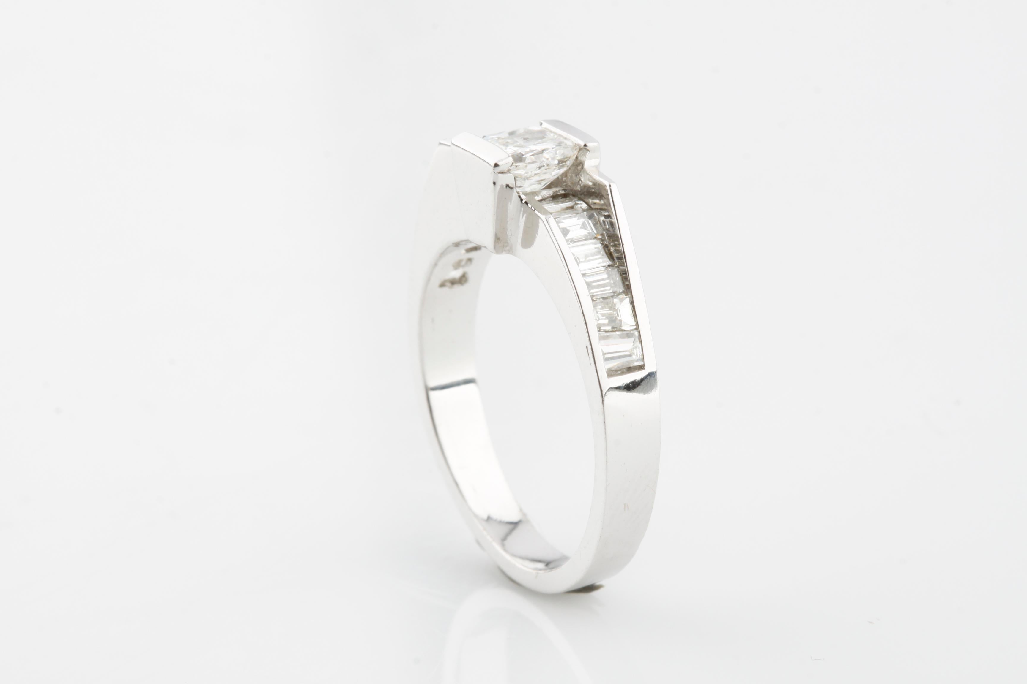 One electronically tested 18KT white gold ladies cast diamond ring with a bright finish.
Condition is good.
Featuring a diamond solitaire supported by diamond set shoulders
Completed by a three millimeter wide band.
Size 6
Identified with markings