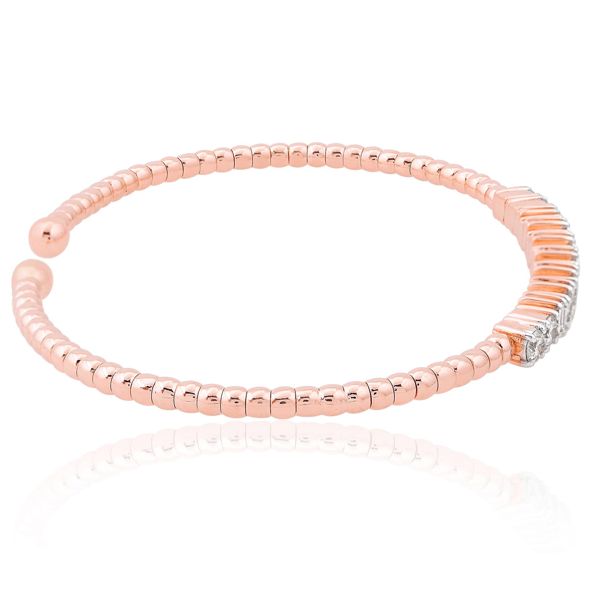 The sleek and sophisticated cuff design adds a modern twist to this timeless piece, ensuring it stands out as a statement of elegance and style. Crafted with precision and attention to detail, the 14 Karat Rose Gold setting complements the diamonds