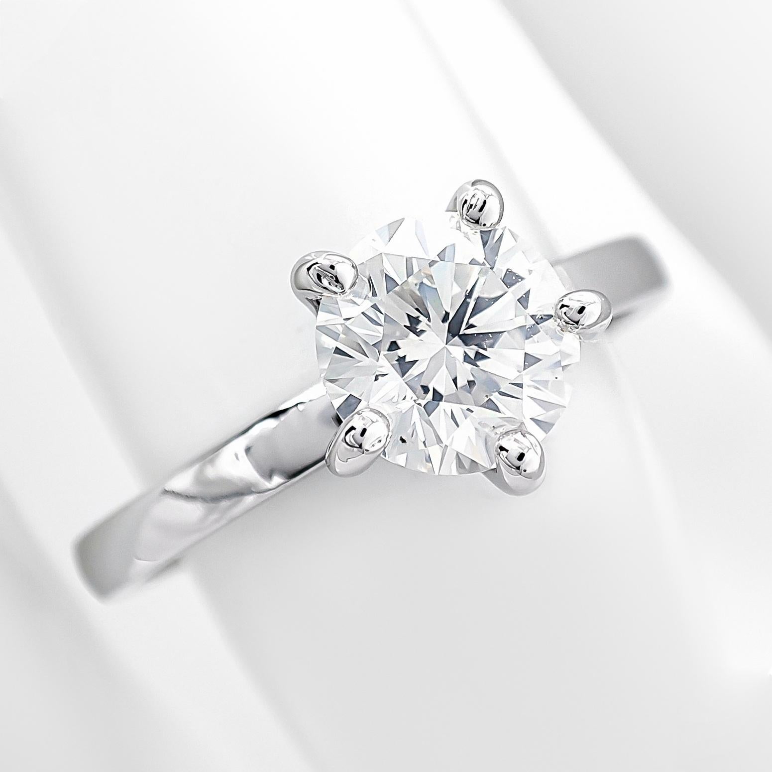 FOR U.S. BUYERS NO VAT NO CUSTOMS FEES

his exquisite ring showcases a 1.05-carat natural round brilliant diamond, celebrated for its near-colorless F hue and remarkable VS2 clarity. Its pristine sparkle and flawless craftsmanship exude timeless