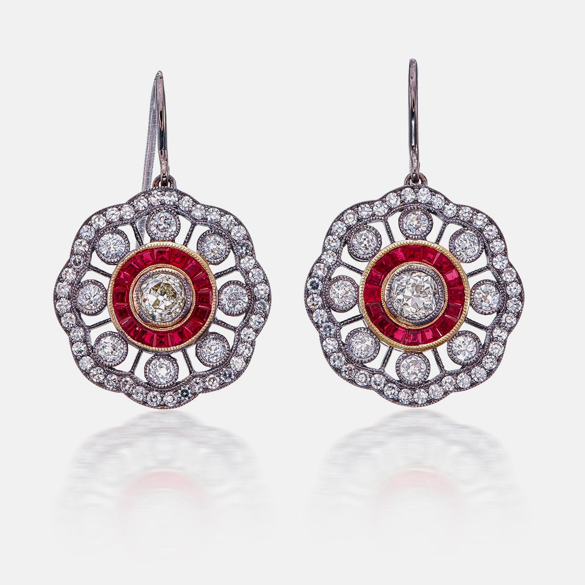 Introducing a classic vintage inspired ruby and diamond earrings by Rewa Jewels. 

The two center old European diamonds weigh a total of 1.05 carat. They are about VS to SI clarity and J to L in color. 

The remaining smaller diamonds weigh 1.90
